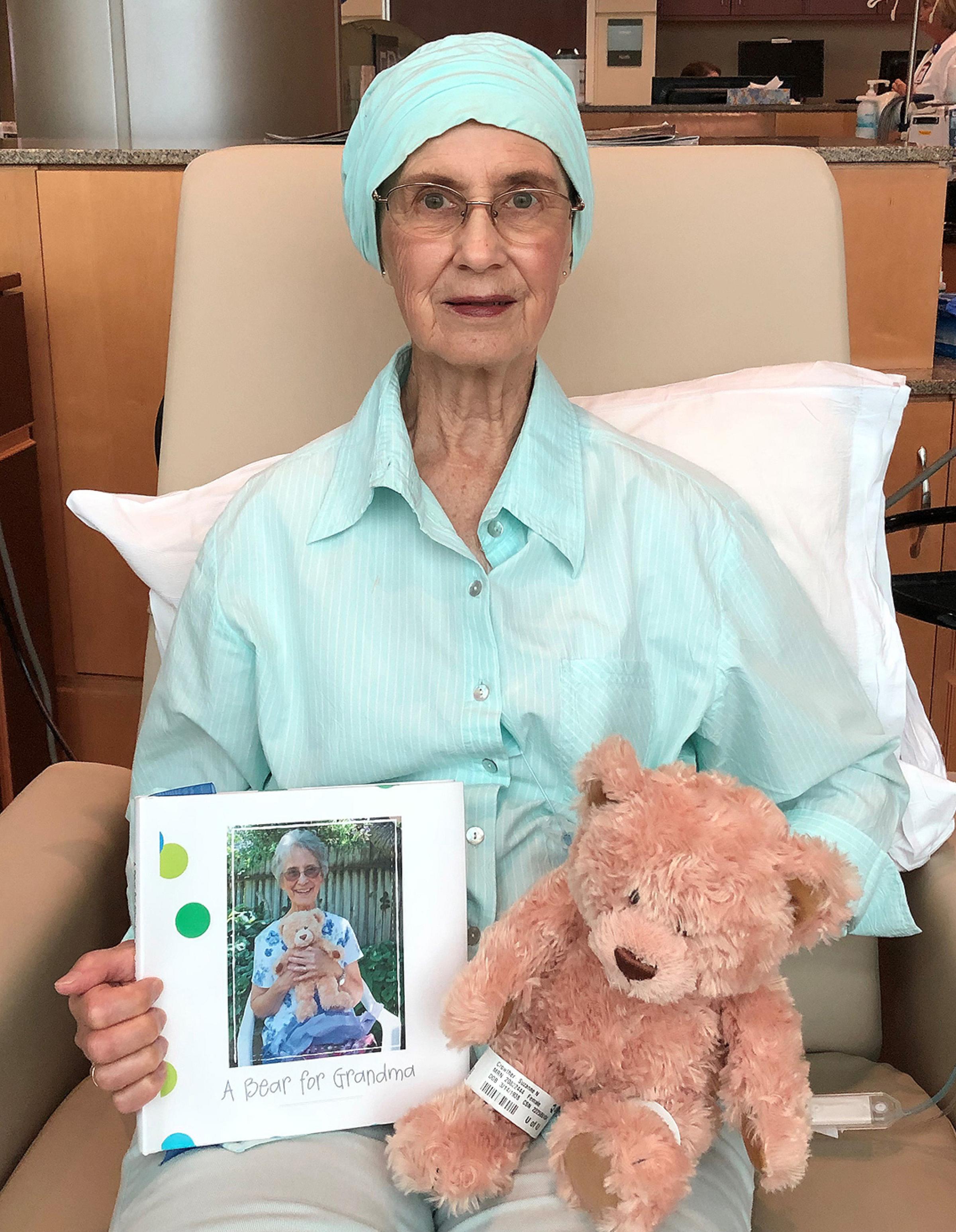 Suzanne Crowther with photo and teddy bear