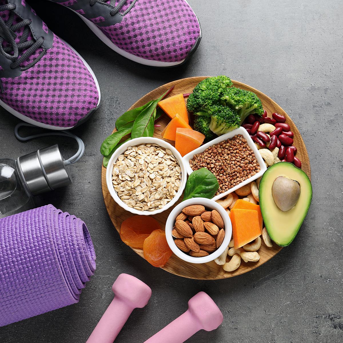 Lifestyle Medicine: image of yoga mat, water bottle, tennis shoes, nutritions foods as an example of health living choices