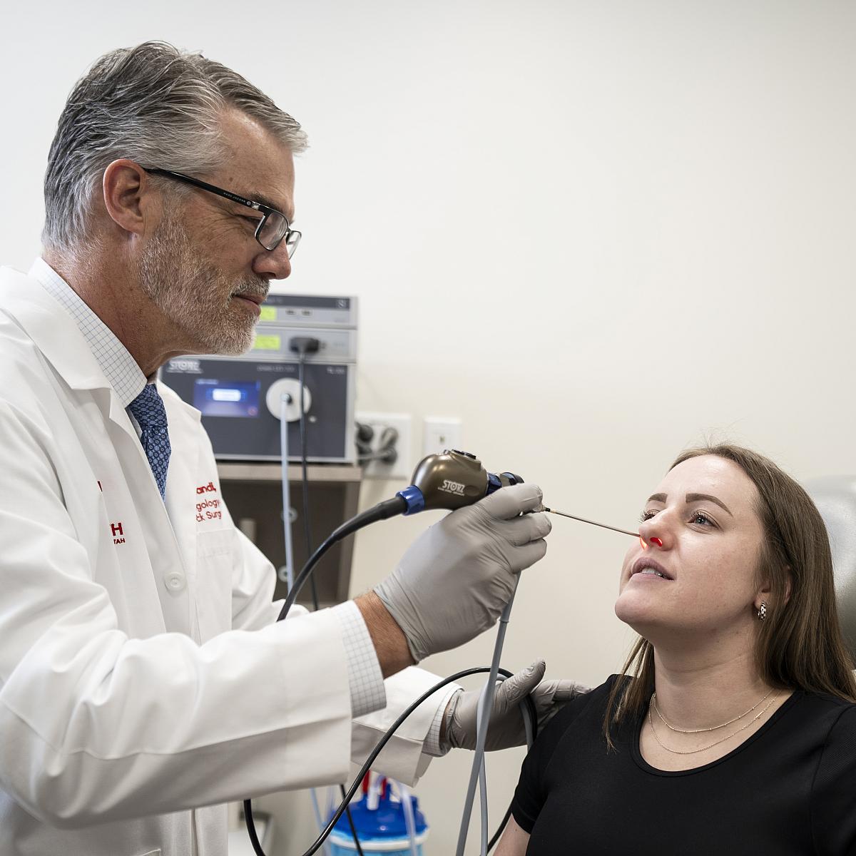 Nasal & sinus specialist Richard Orlandi, MD, with female patient