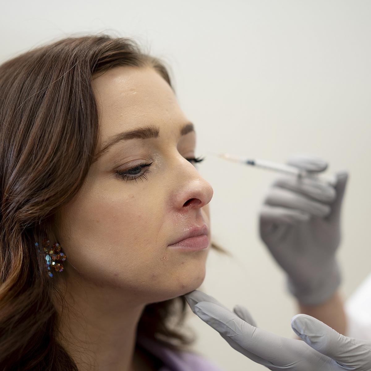 Female patient receives facial injectables