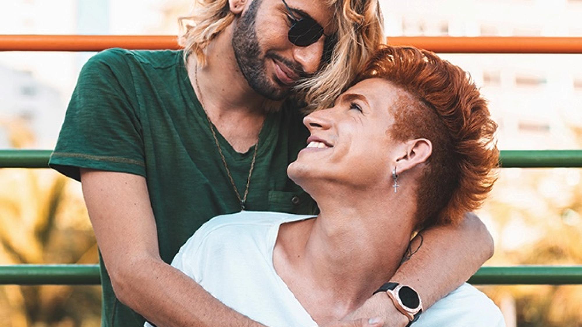 Male man of color with his arms around his partner