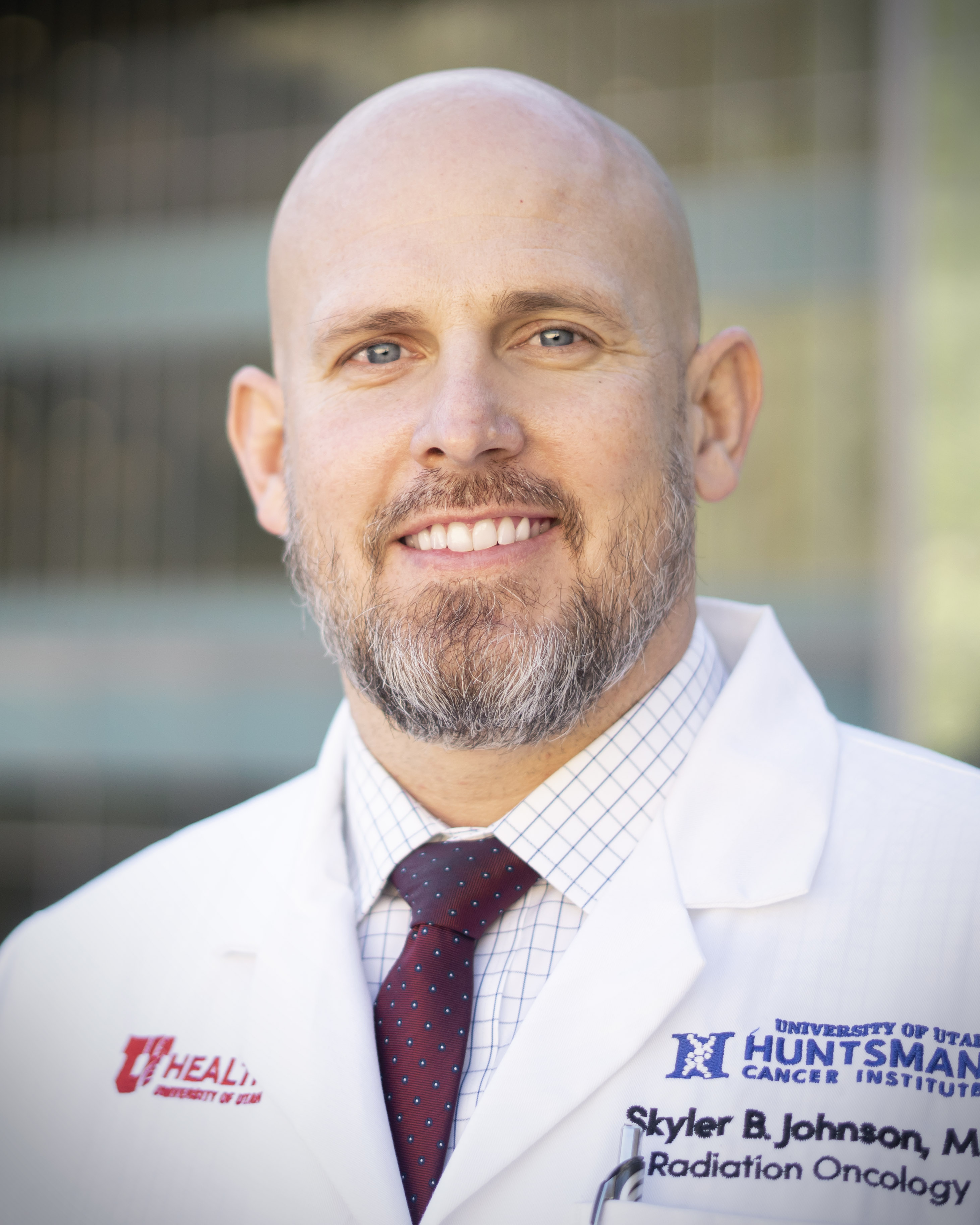 Skyler Johnson smiling wearing white lab coat