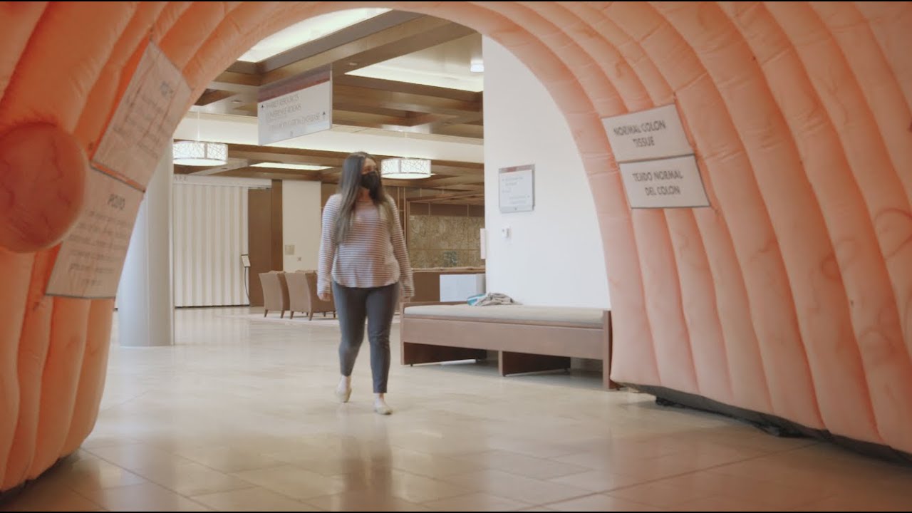 Woman Walking Through Colon Cancer Exhibit