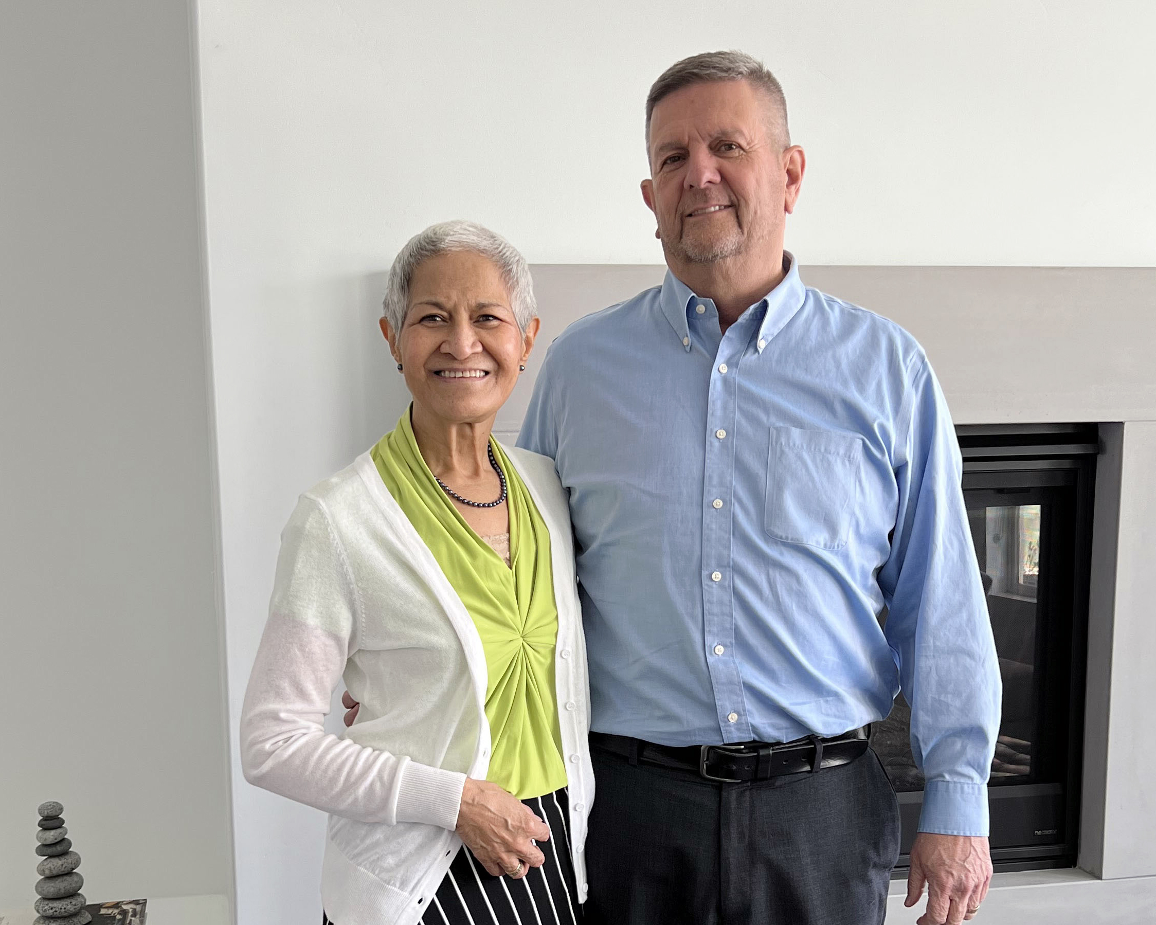 Jeanette and Doug Nielsen standing with their arms around each other