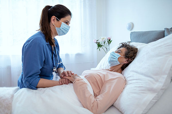 Photo of nurse caring for patient