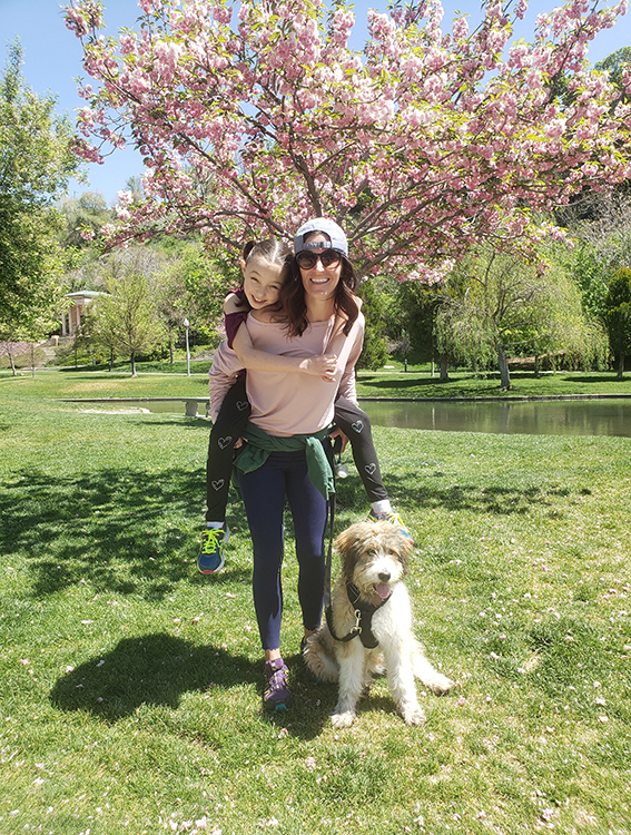 Morgan with her niece Scarlett and her dog, Whitney, at Memory Grove hiking and enjoying the spring blossoms in April 2020