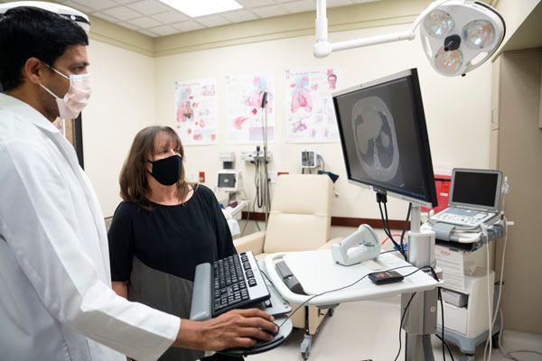 Chakravarthy Reddy, MD and Lynette Phillips review her screening results