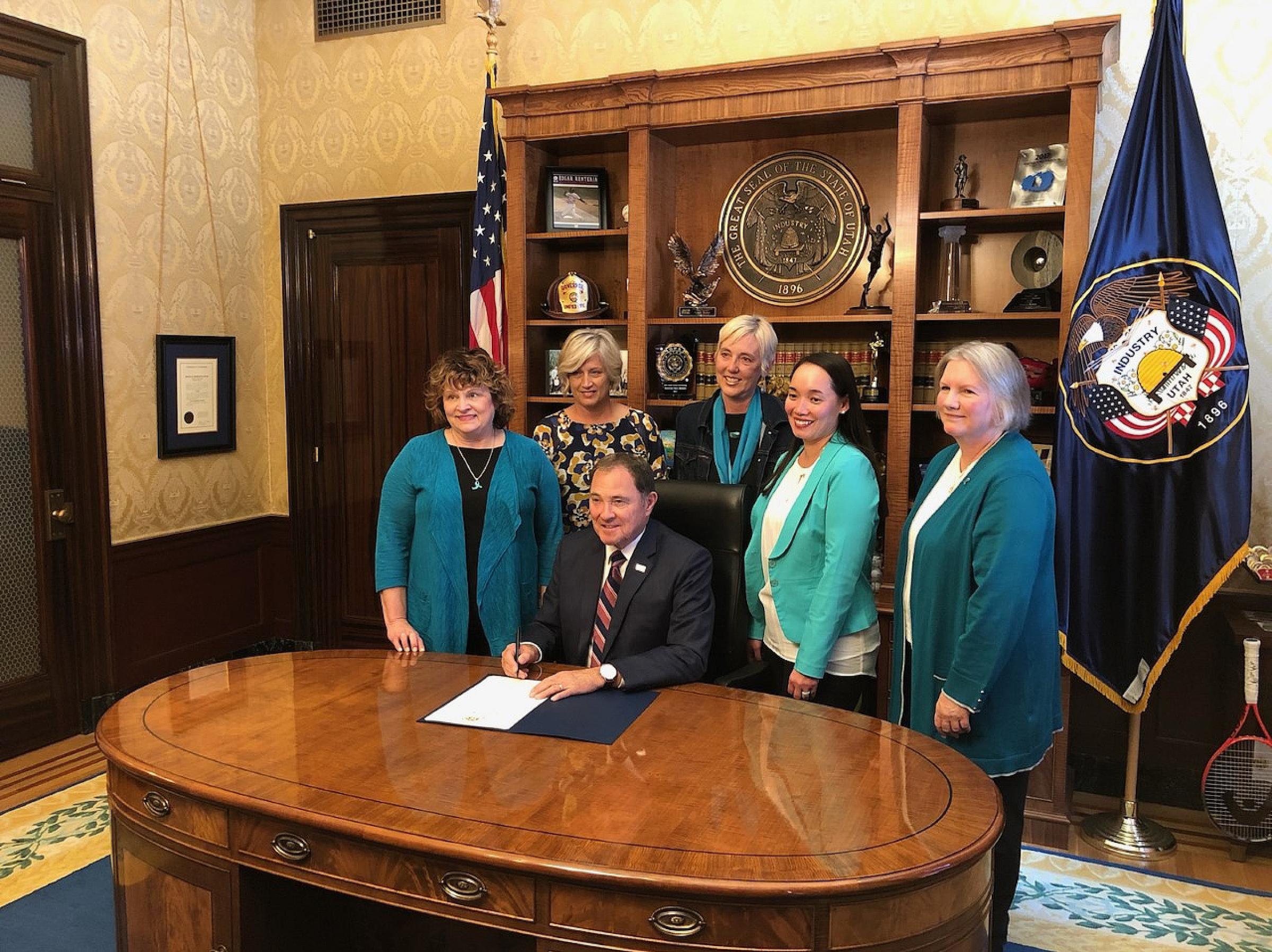 Jan Byrne (far left) with colleagues and Governor Herbert at a ceremony declaring September Ovarian Cancer Awareness Month in 2019