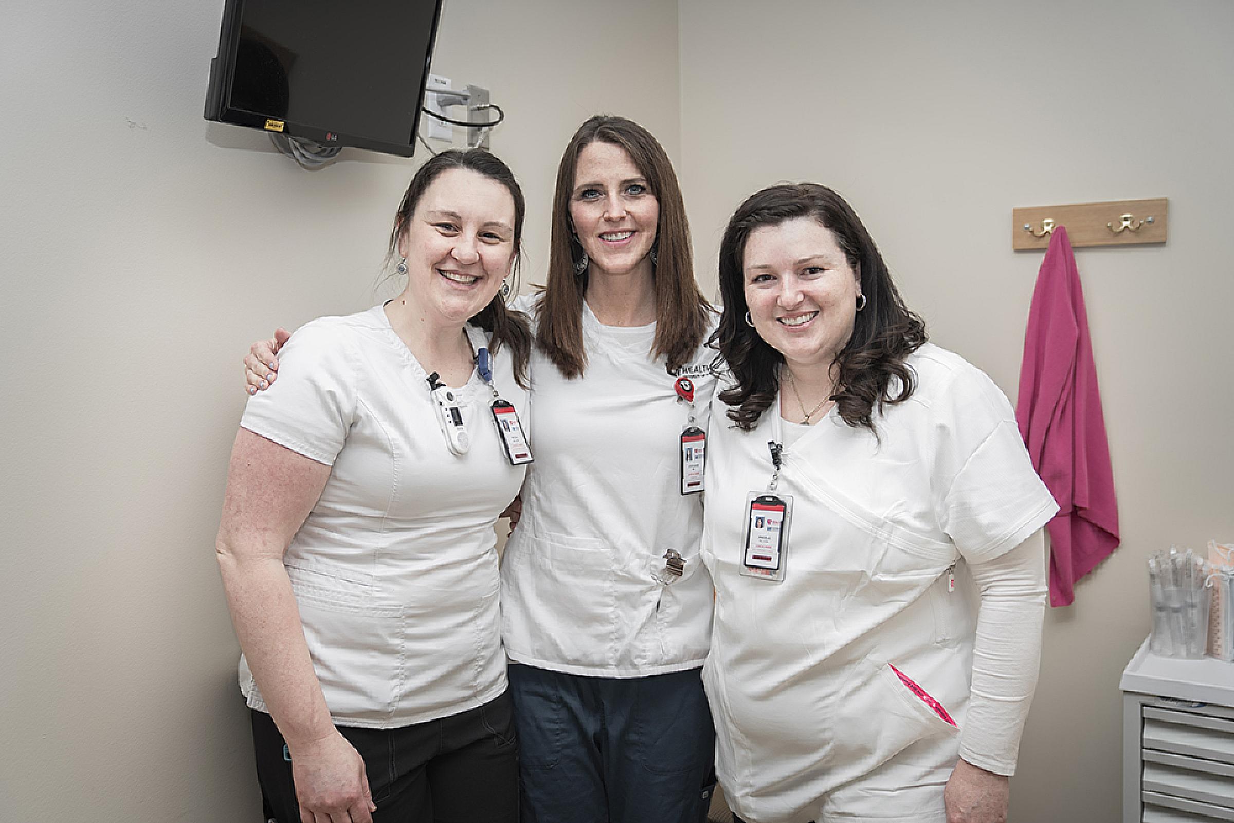 Three nurses smiling for their picture