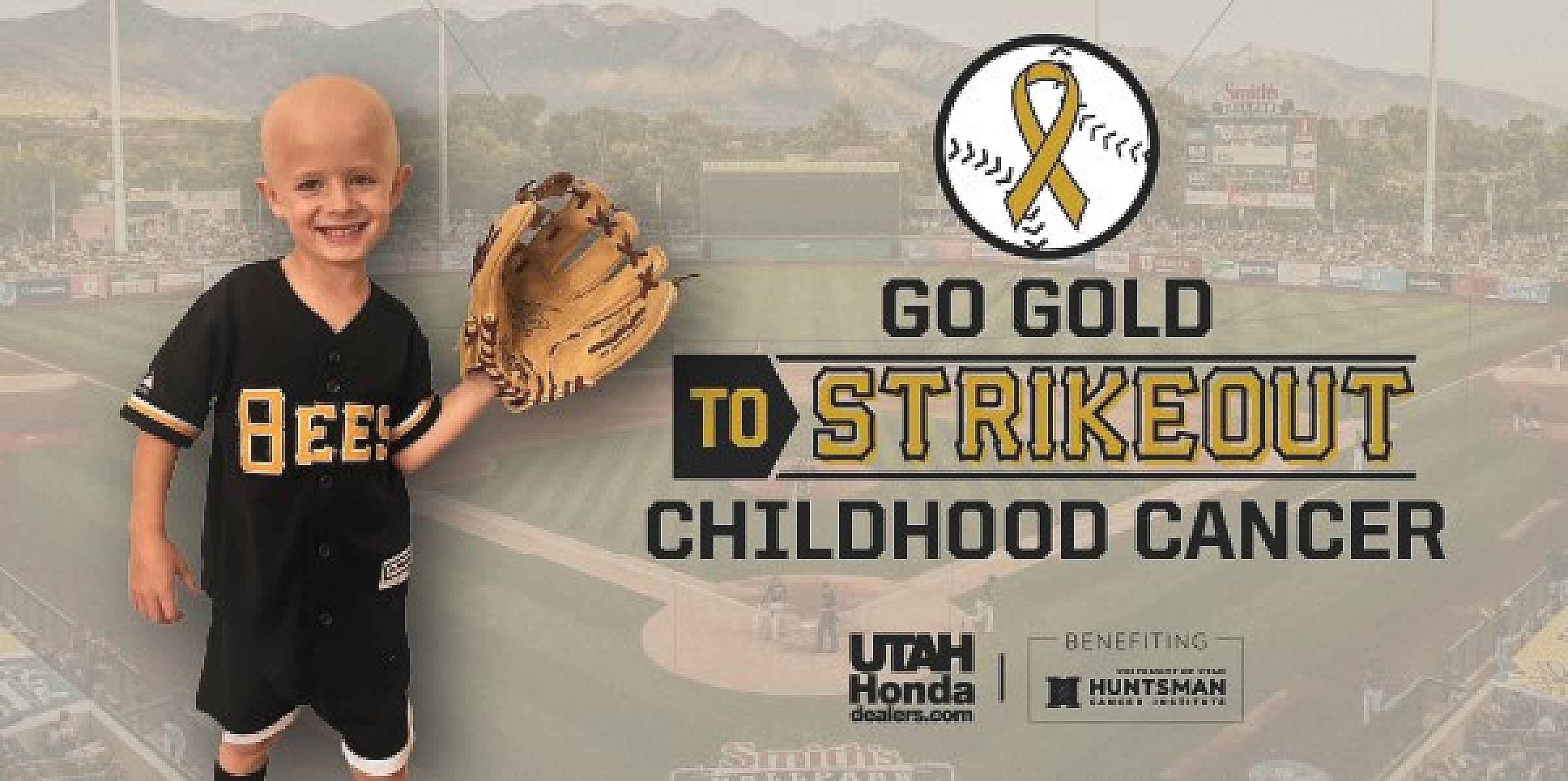 Marshall wearing a catcher's mitt in front of an ad for Go Gold to Strikeout Childhood Cancer