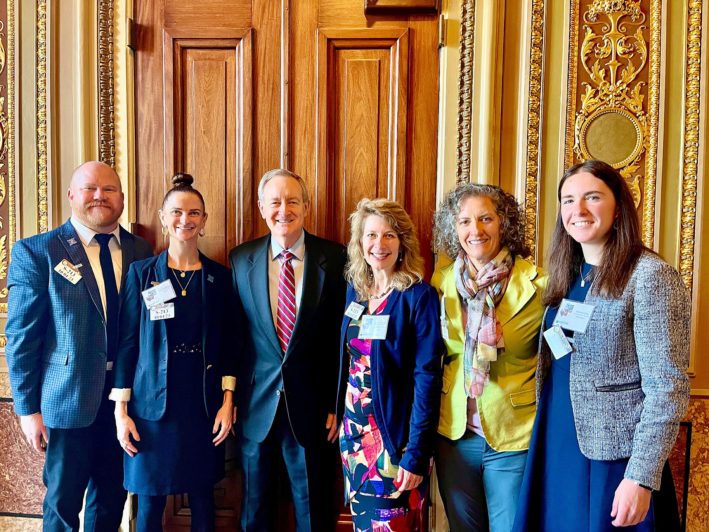 Senator Mike Crapo (ID) with Garrett Harding, Becky Creighton, Dr. Neli Ulrich, Theresa Vonada, and Brittany Cory after their meeting.