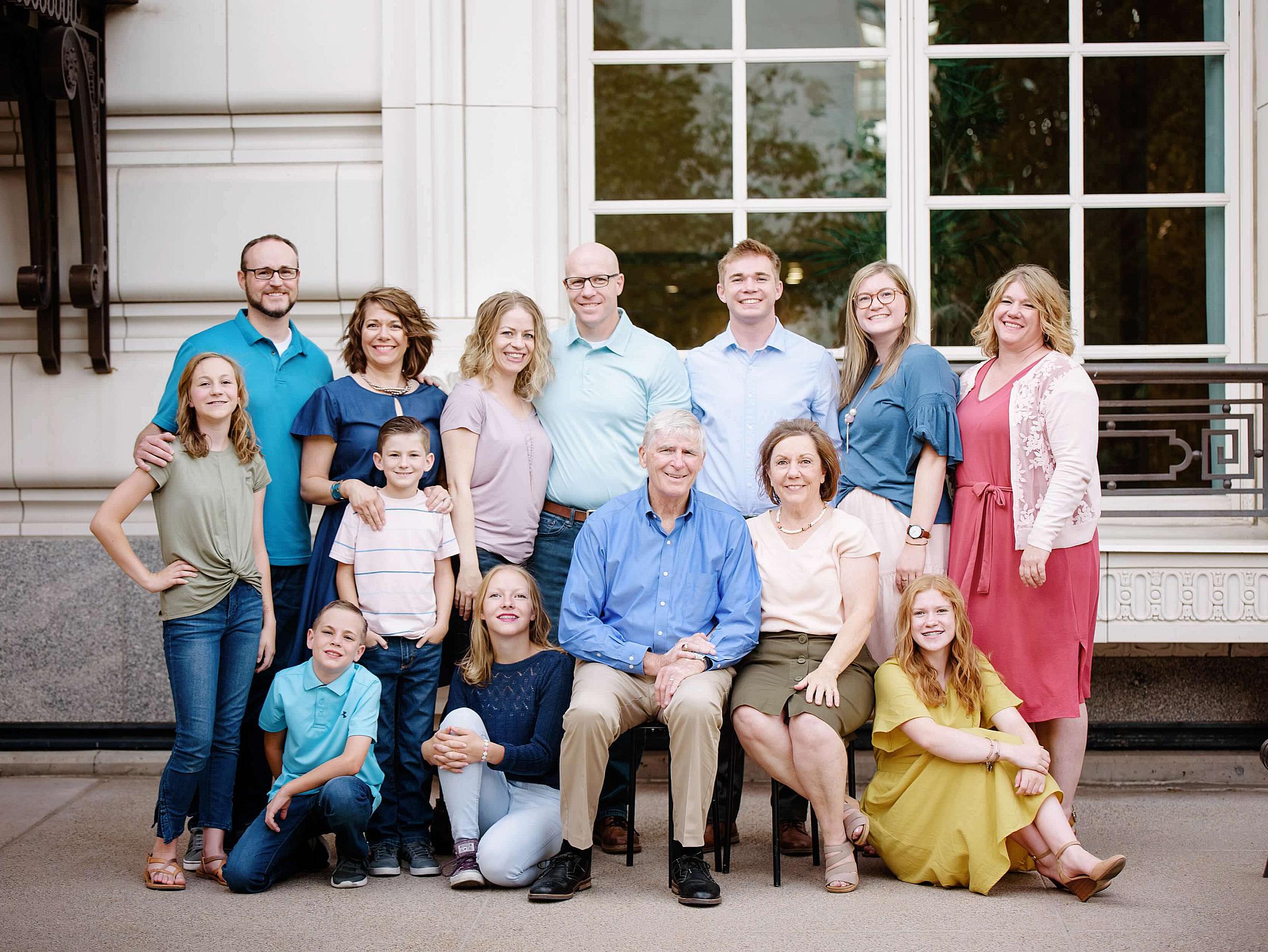 Jerry and Tad Simonson with their children and grandchildren, posing for a group photo.