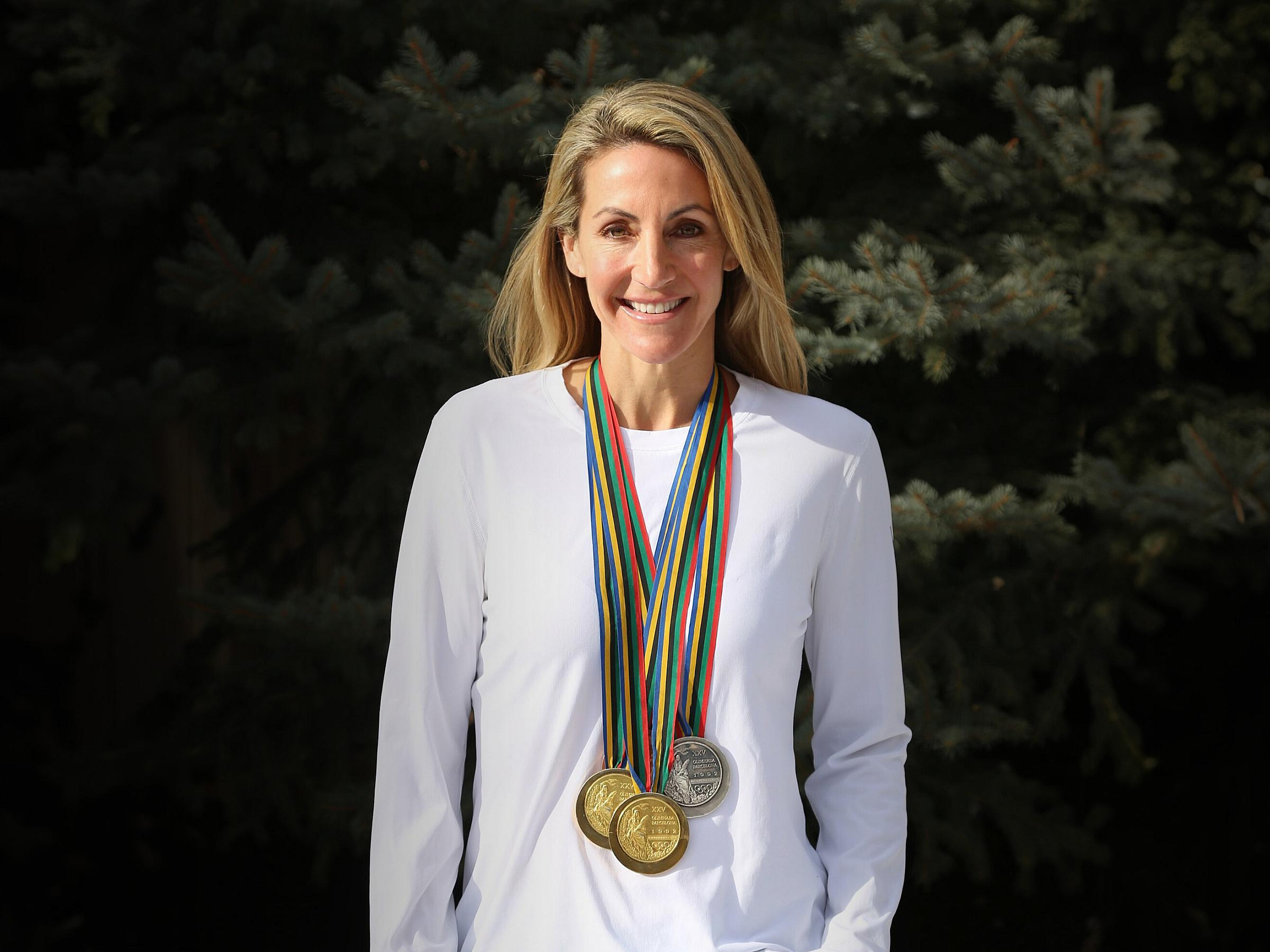 Summer Sanders wearing her Olympic medals