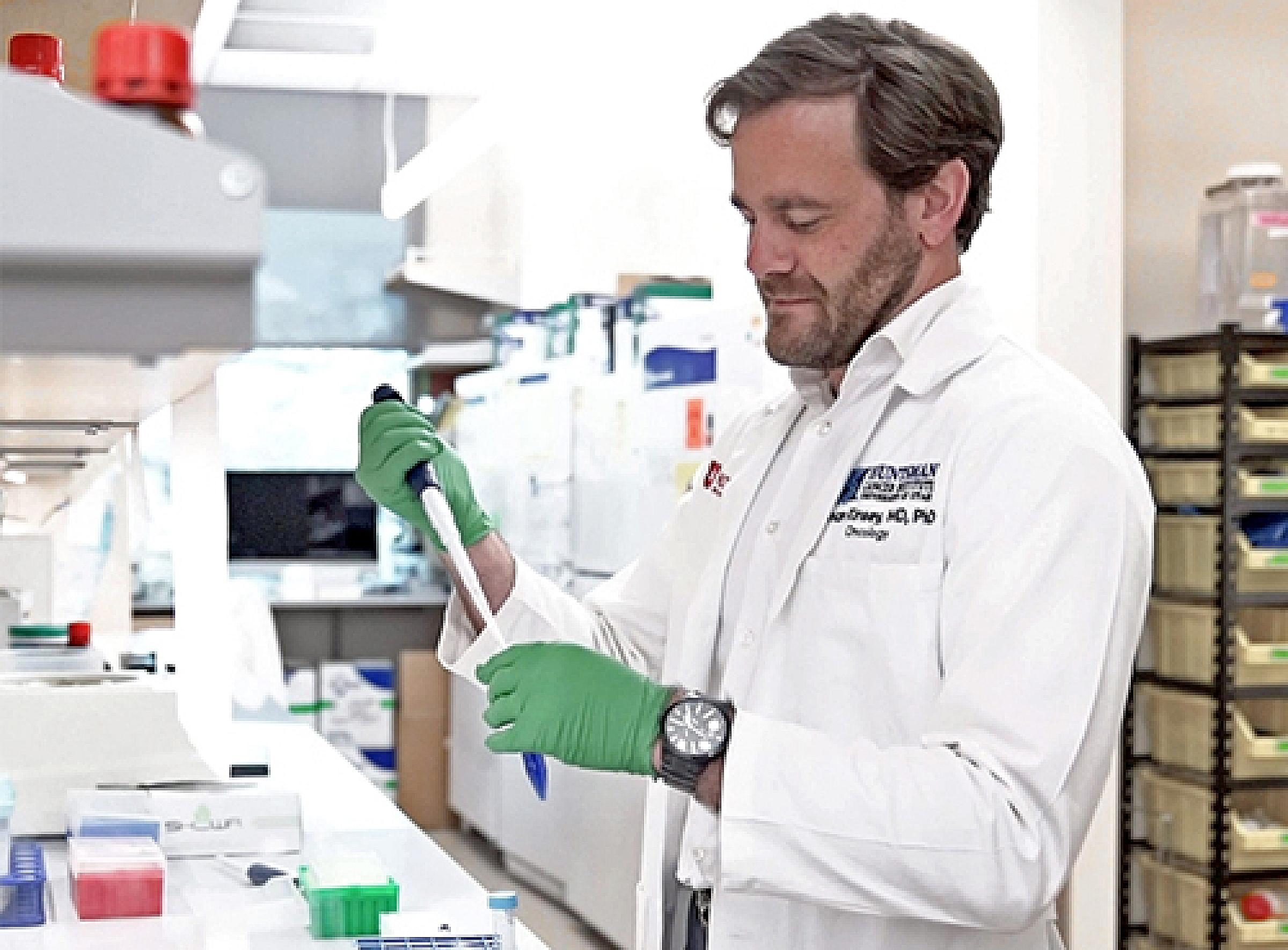 Conan Kinsey, MD, PhD, at work in the lab