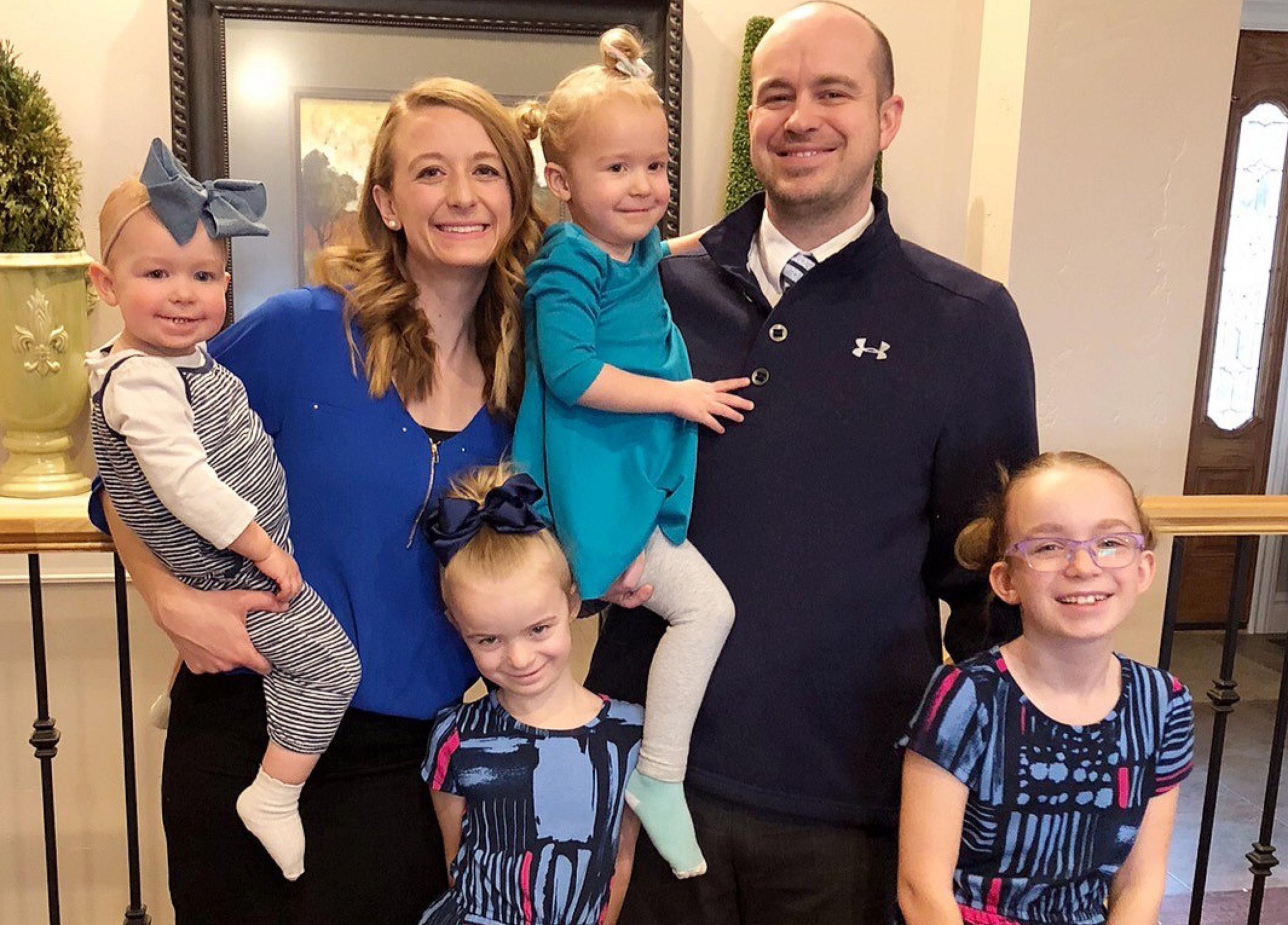 Taryn Palmer and her family on dress in blue day