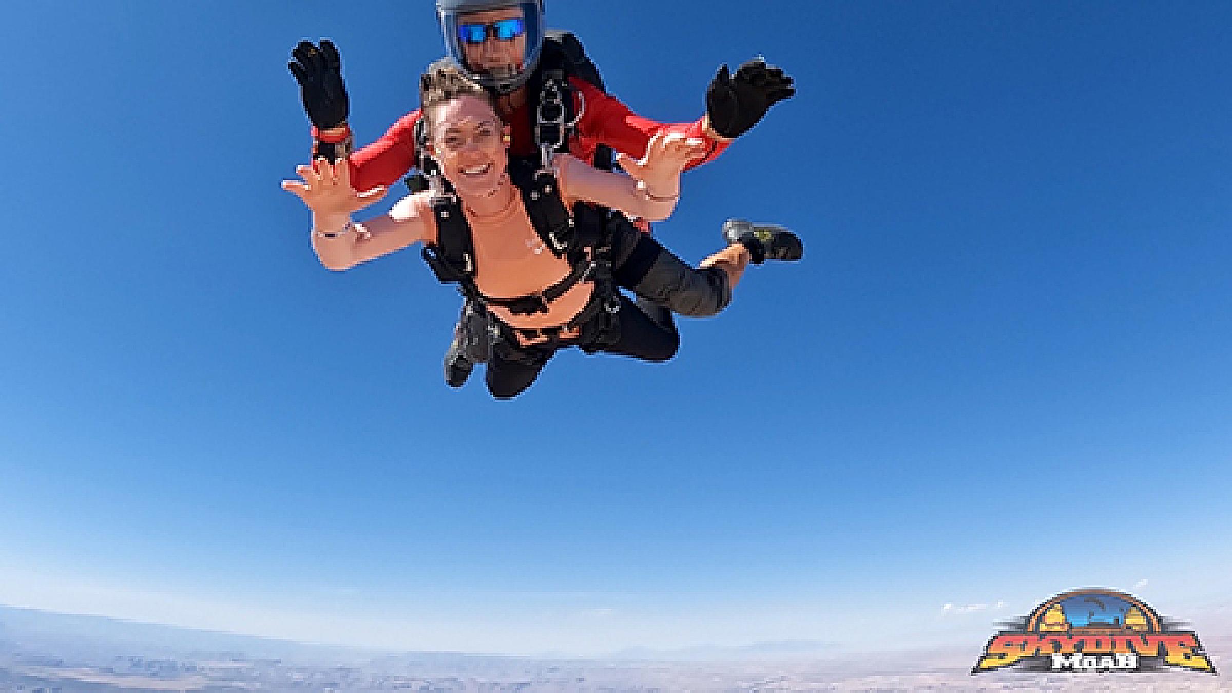Erin Hurst skydiving in tandem with her instructor at Skydive Moab