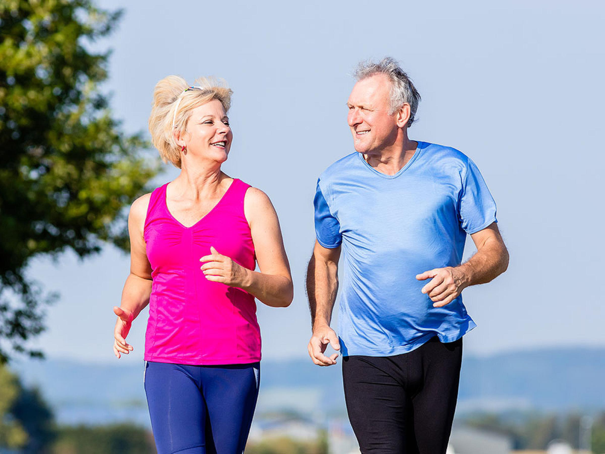 Man and woman running outdoors