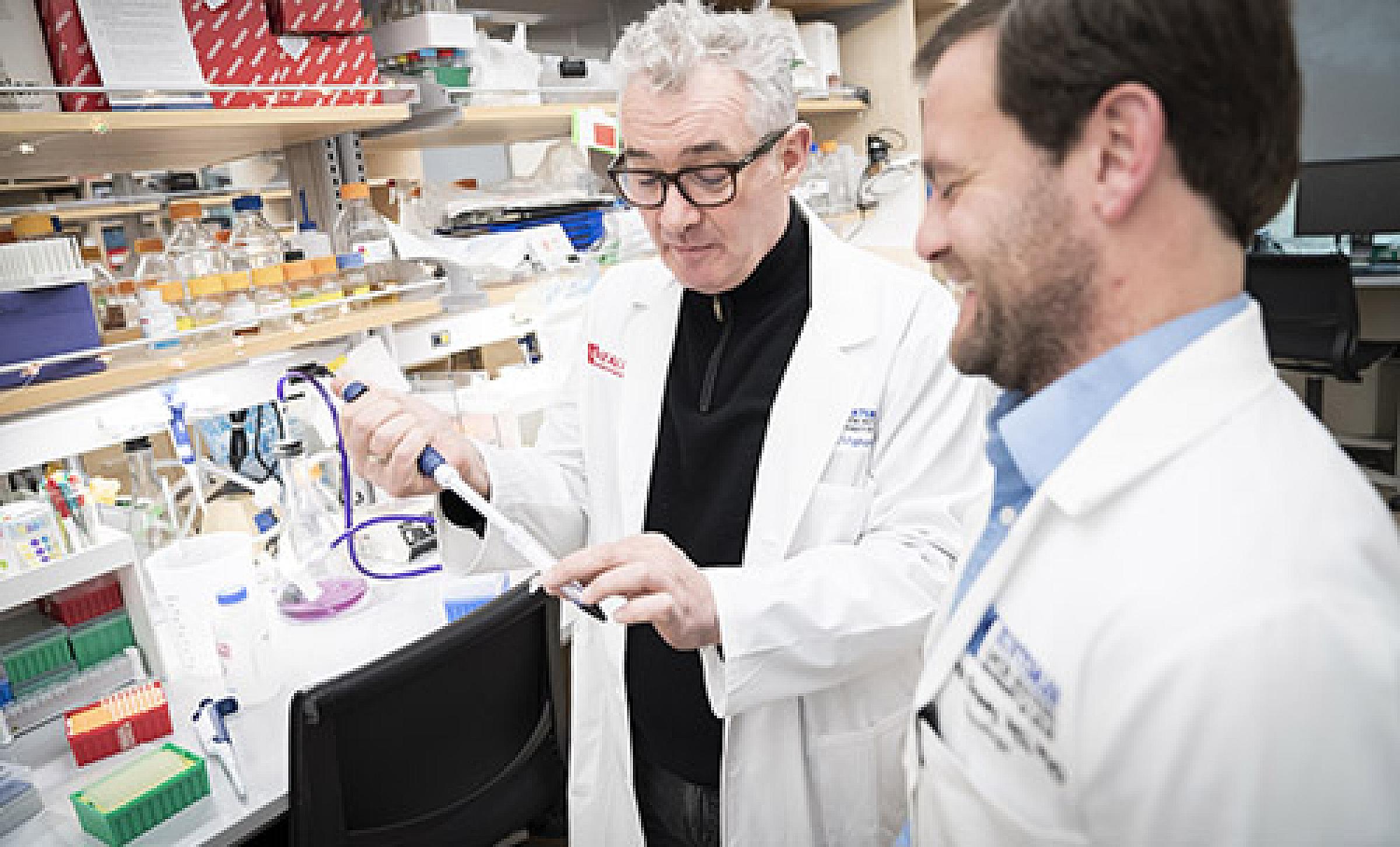 Martin McMahon, PhD and Conan Kinsey, MD in the lab