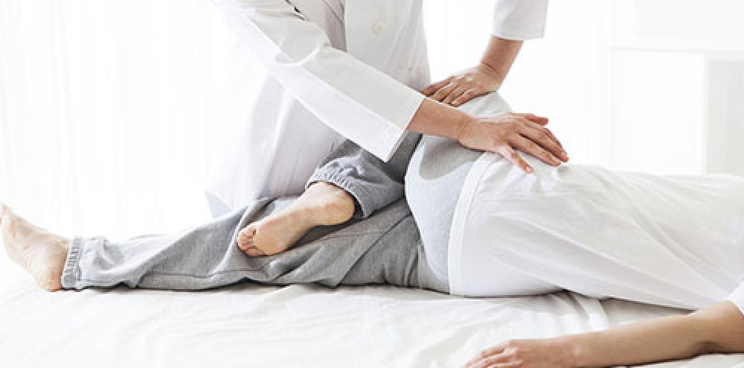 Osteopathic doctor treating leg and hip