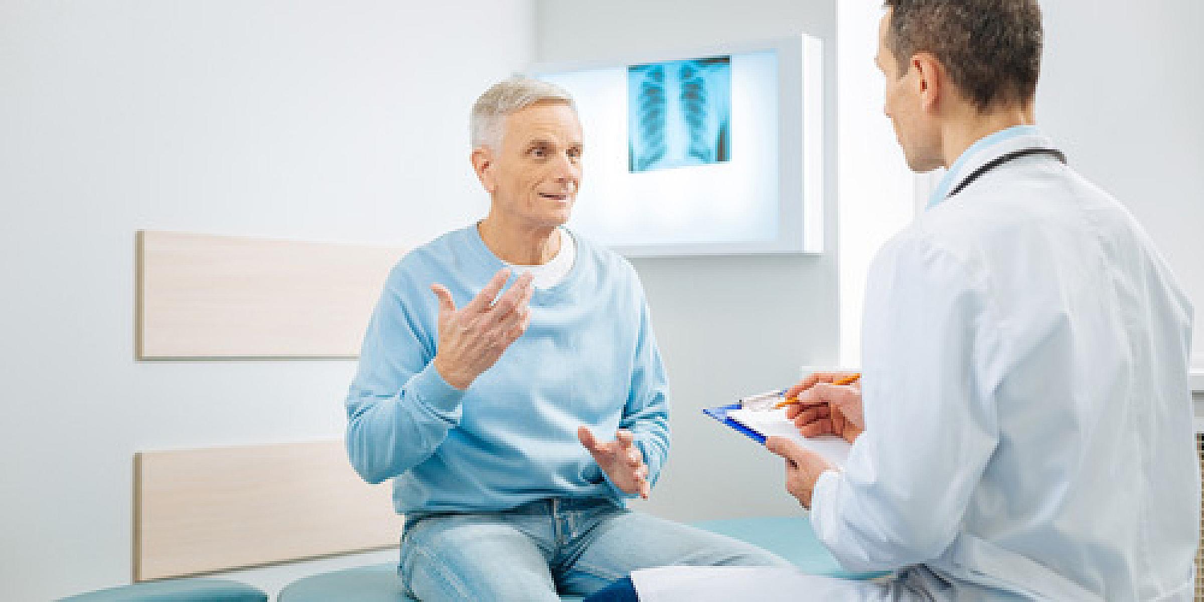 Male patient asking physician a question