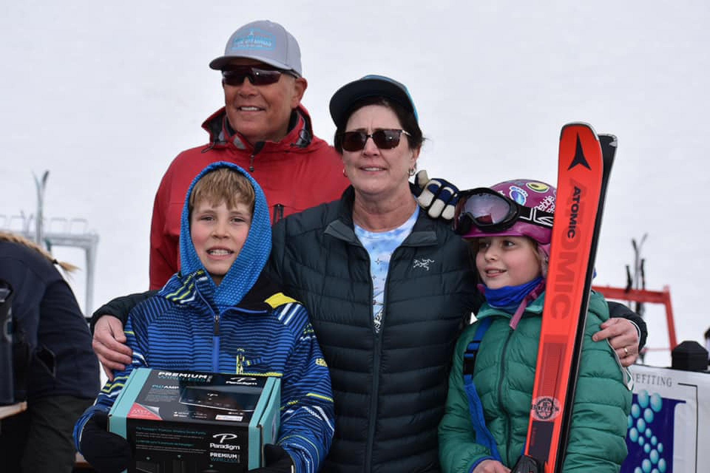 Zach and Tami Parris with prize winners during the 2021 Ride on Dads event at Pebble Creek Ski Area