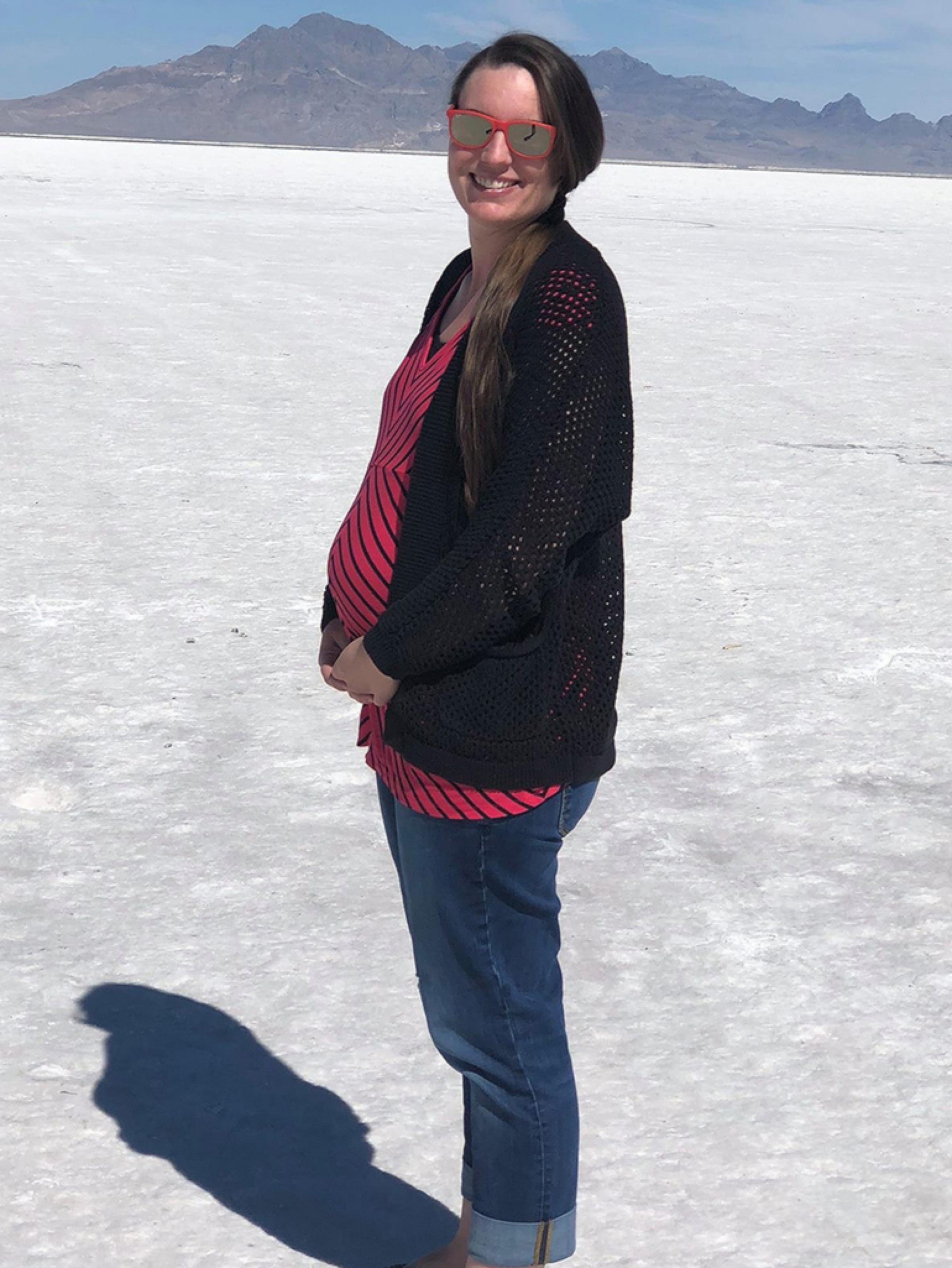Sarah standing on the salt flats while pregnant