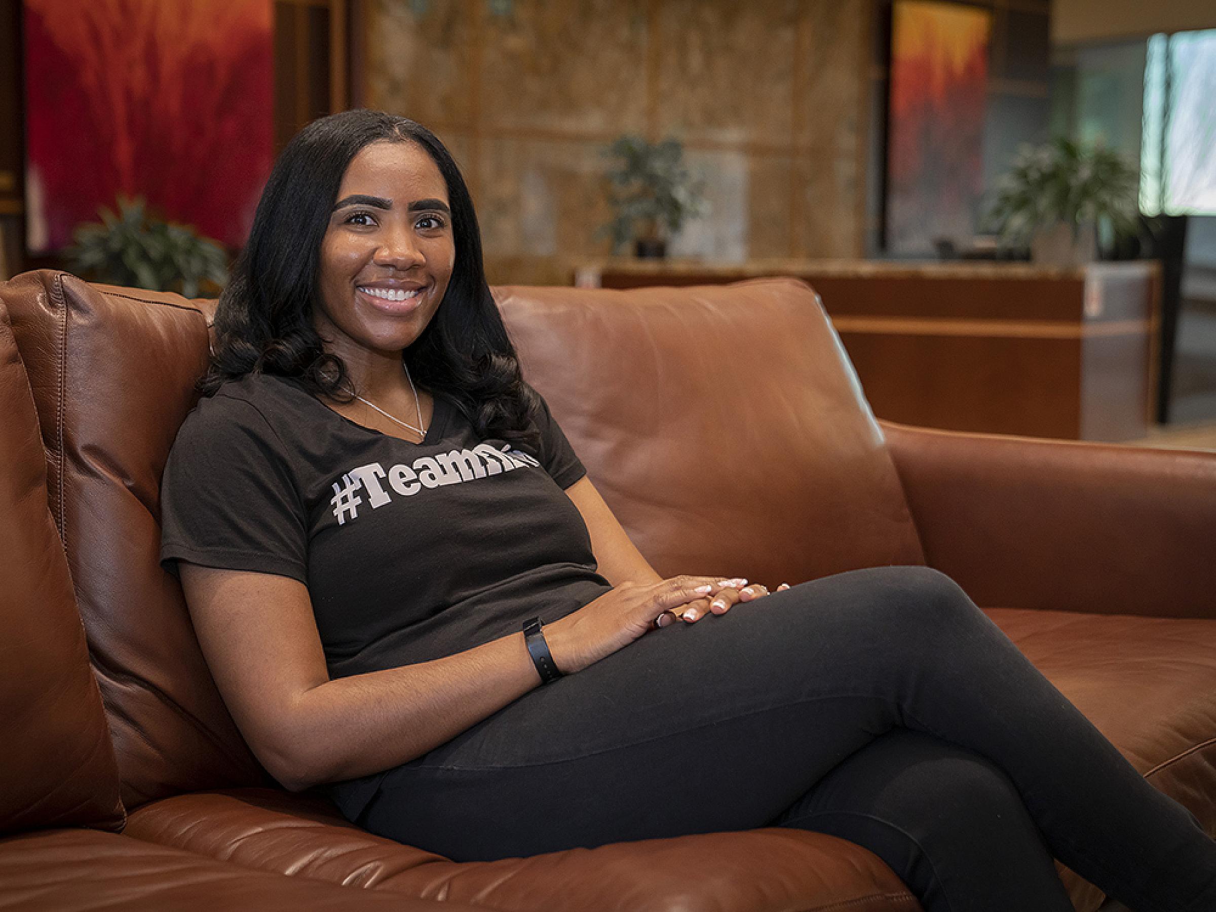 Tiana Rogers Sitting on Brown Couch