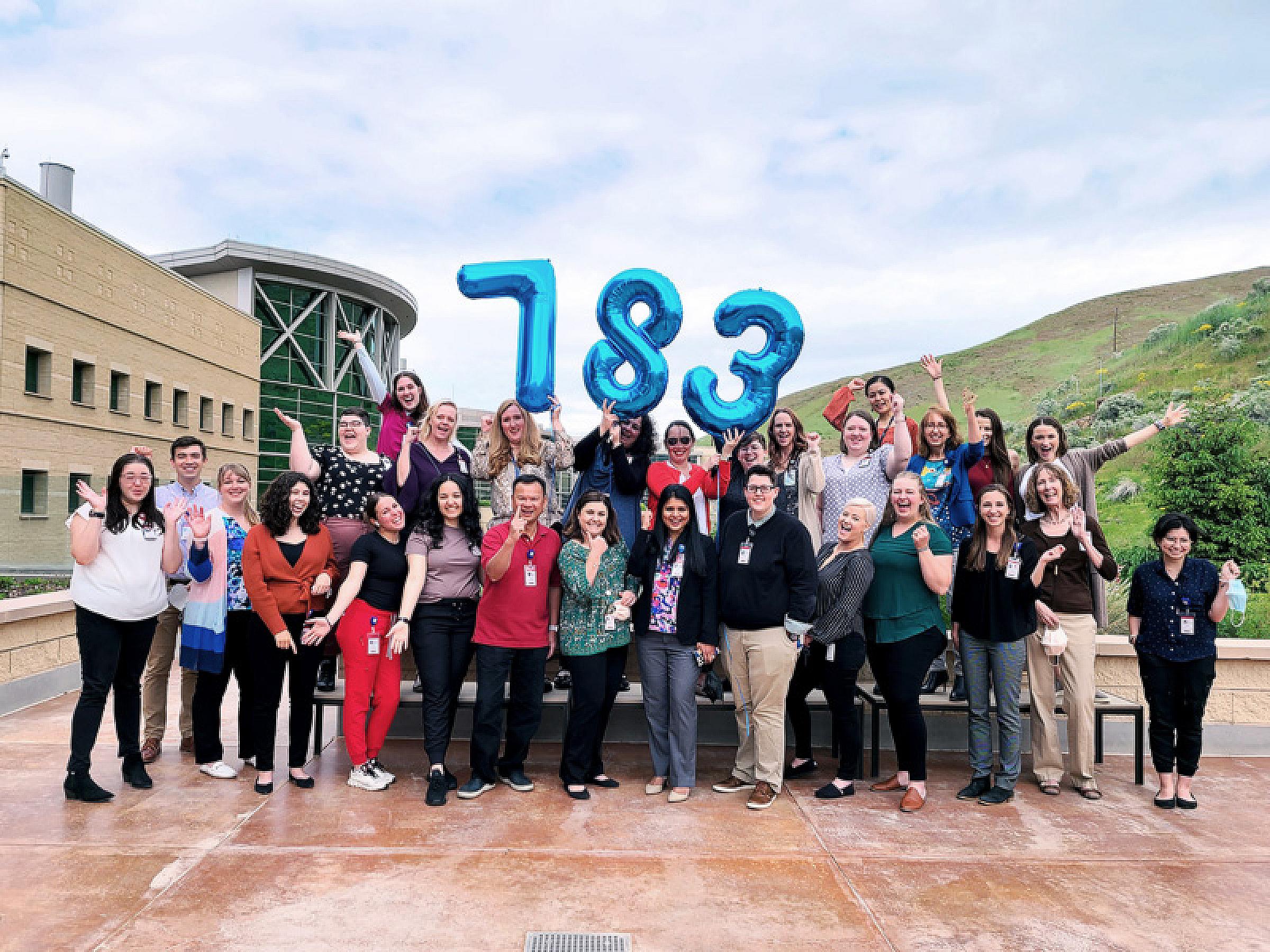 Members of the Huntsman Cancer Institute Clinical Trials Office celebrate record number of patient participation in clinical trials in 2021.