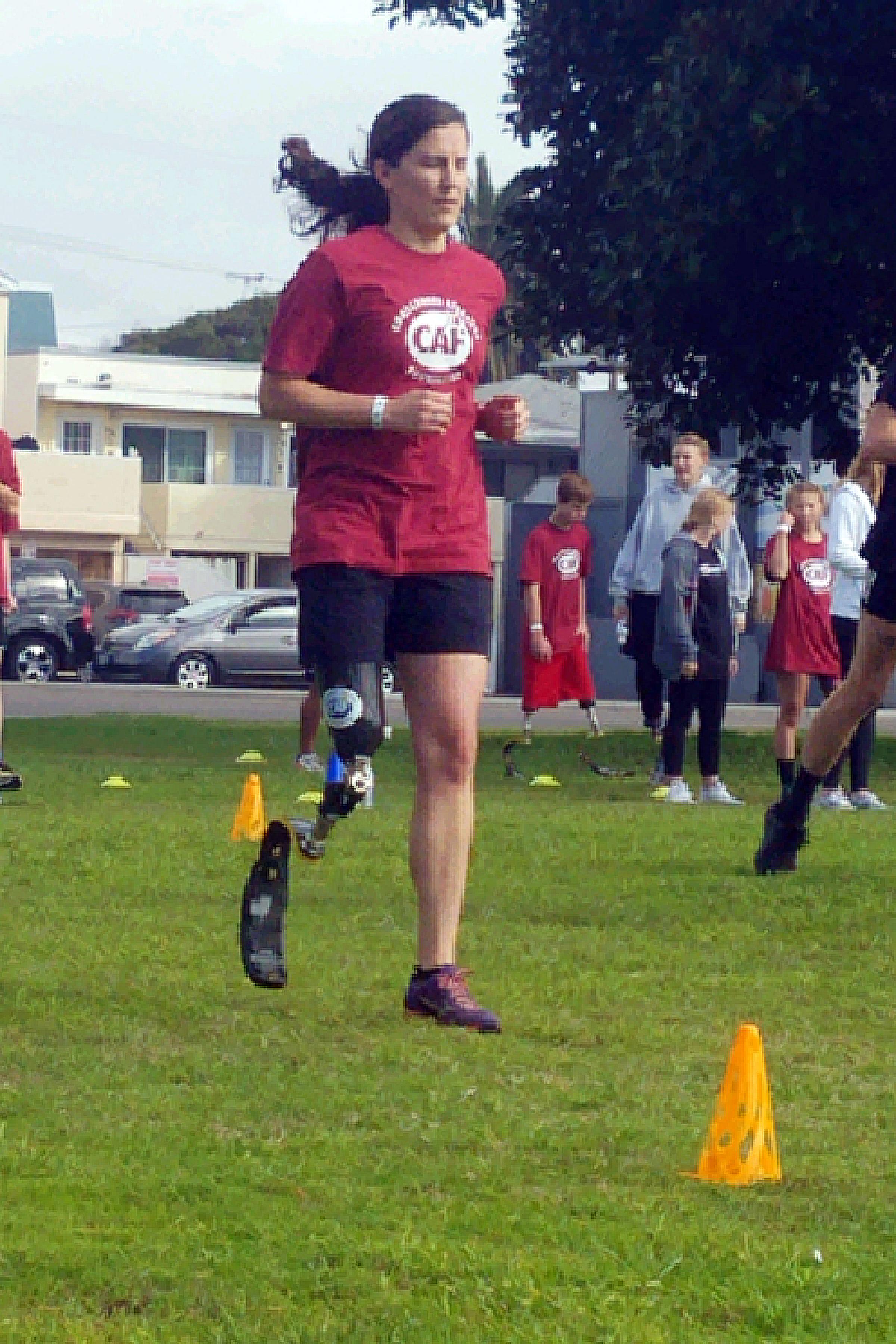 Jenny participating in an amputee running clinic sponsored by The Challenged Athletes Foundation