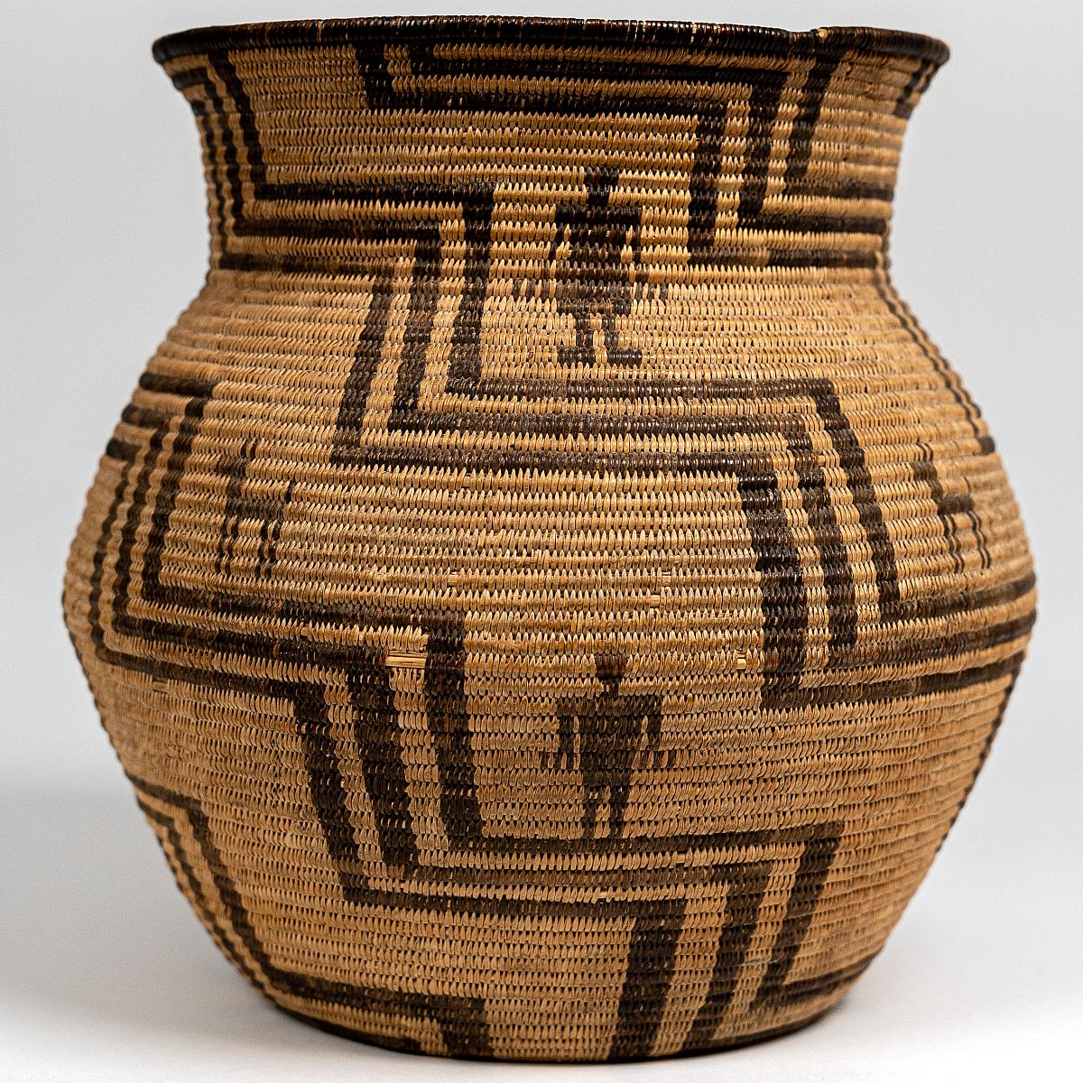 Apache Vase Basket featuring human and deer figures among a terraced diagonal motif