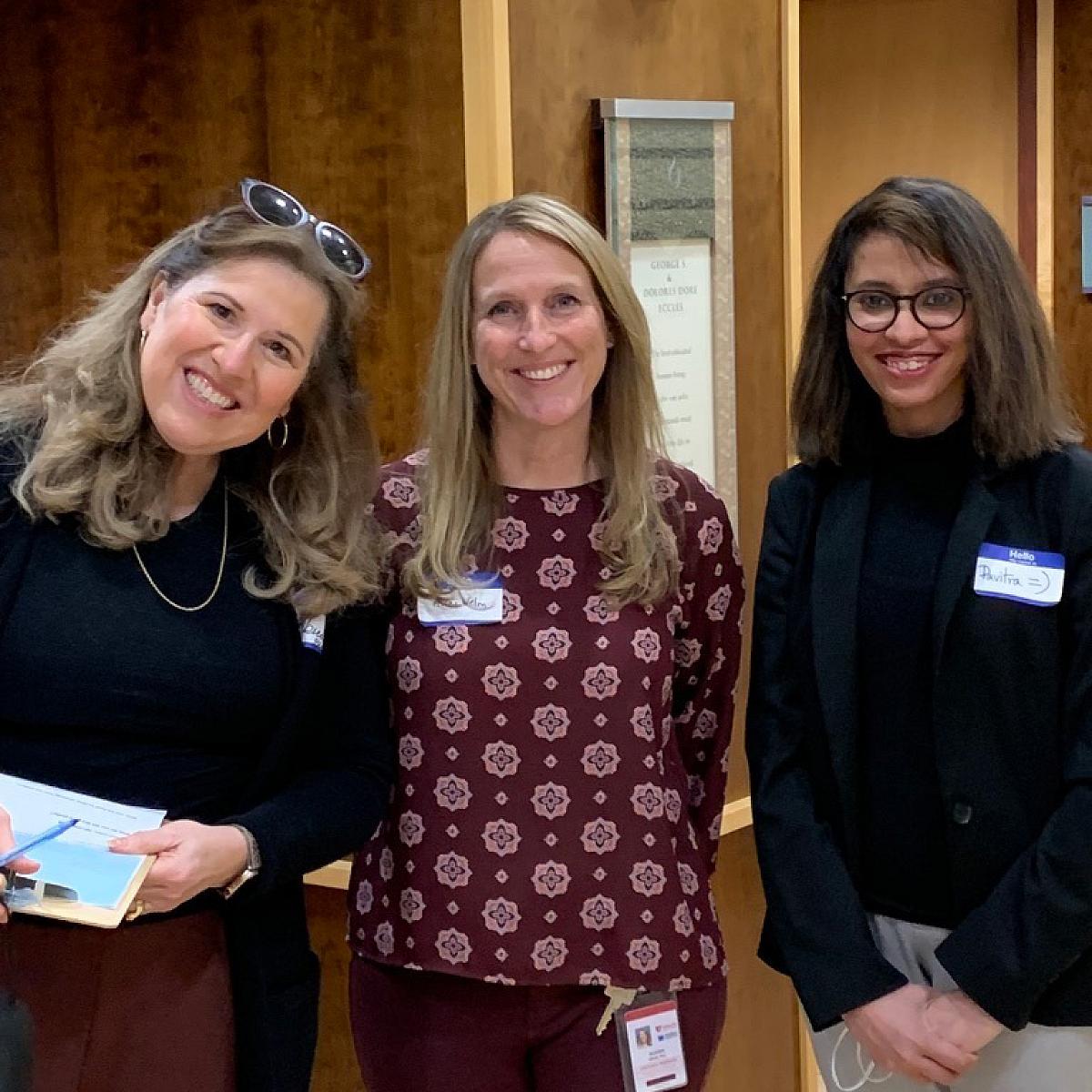 Advocate Rebecca Cressman joins Dr. Alana Welm and Project Next Symposium presenter Pavitra Viswanath at the symposium's poster session. Pavitra Viswanath is graduate student in the A. Welm Lab.