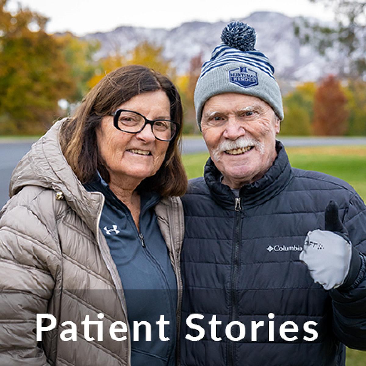 Senior couple smile at camera with the an overlay of the text "Patient Stories"