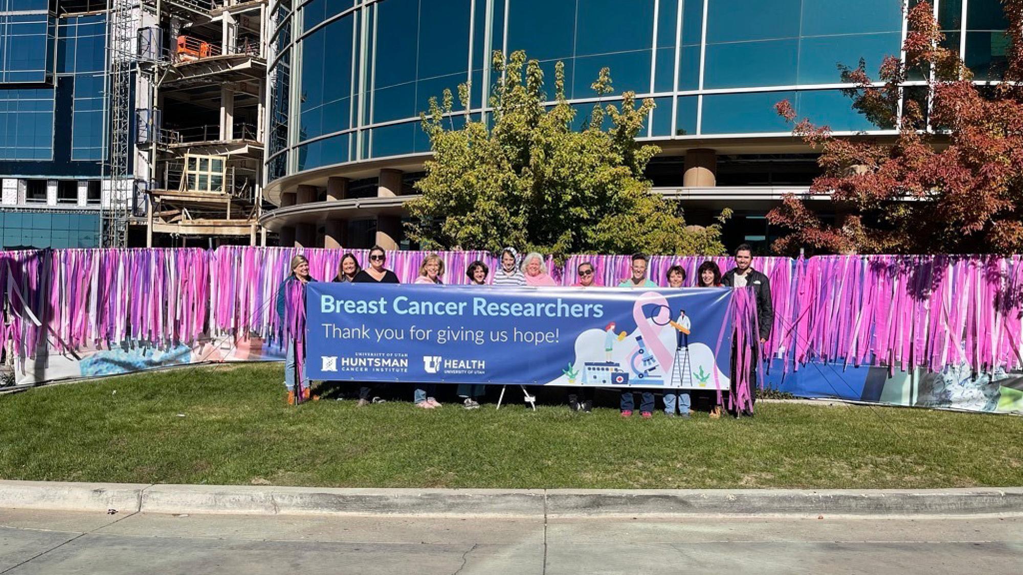 Advocates initiated an art installation of ribbons along the fence outside Huntsman Cancer Institute - Cancer Hospital South during national breast cancer awareness month to thank researchers for giving patients hope.