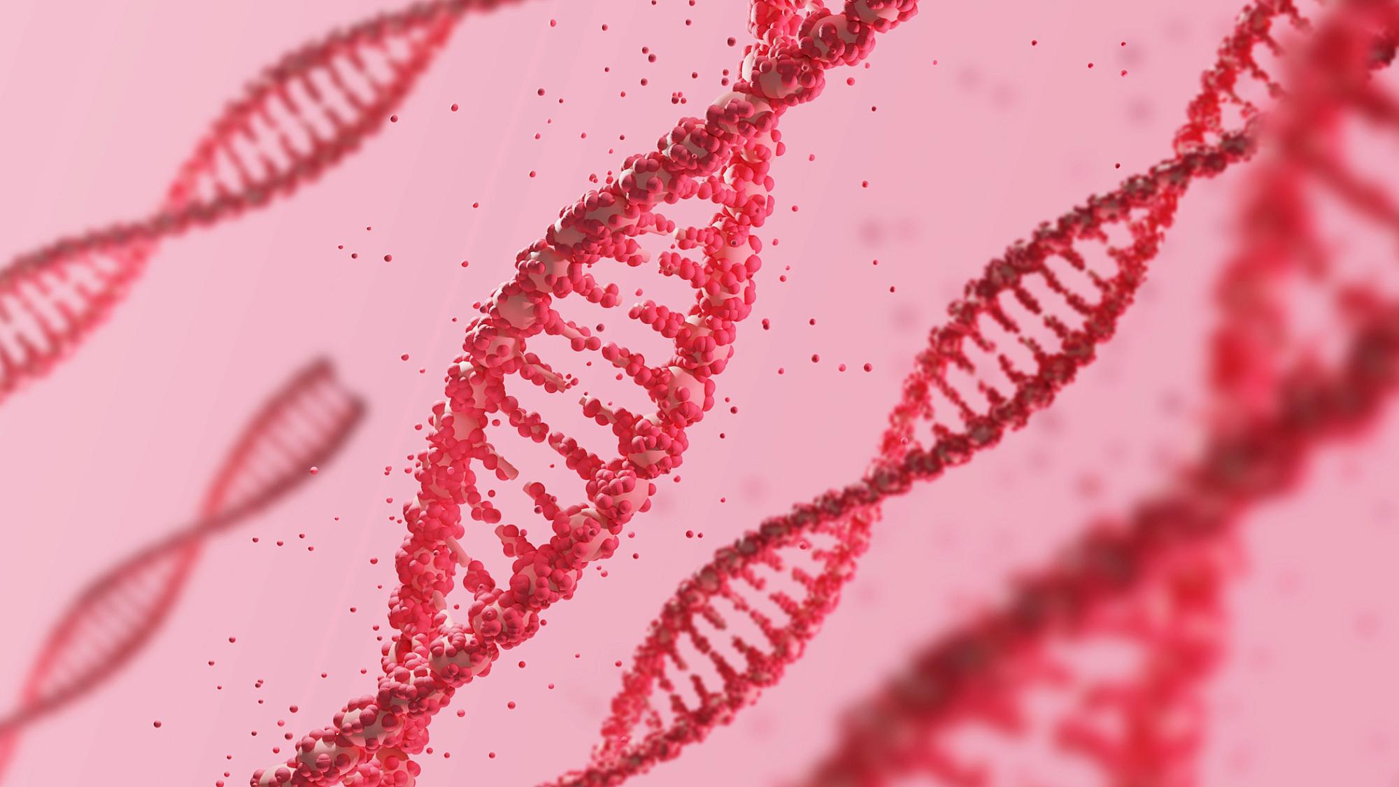 Computer generated red DNA helix against a pink background