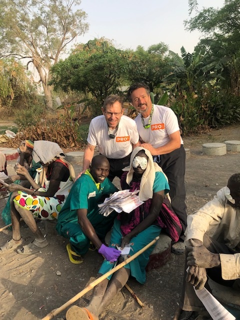 Dr. Alan Crandall, Moran Eye Center (left), and Dr. Geoff Tabin, Himalayan Cataract Project, with patients in South Sudan.  Photo courtesy of the Himalayan Cataract Project 