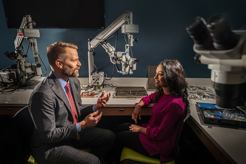 Vice Chair of Education Jeff Pettey, MD, speaks with intern Abigail Jebaraj, MD, in the Moran wet lab.