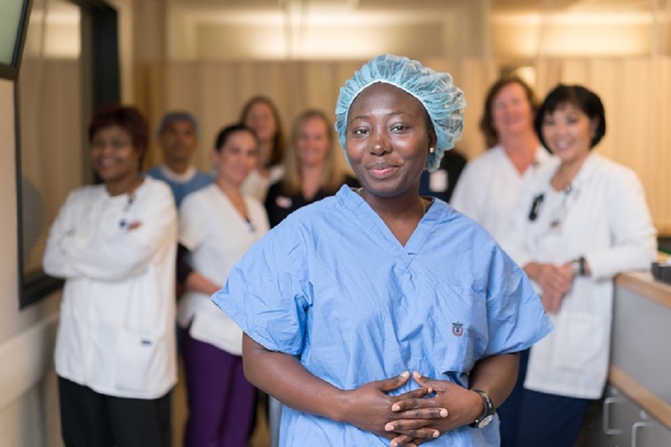 Vida Addo Boateng with nurses at the Moran Eye Center.