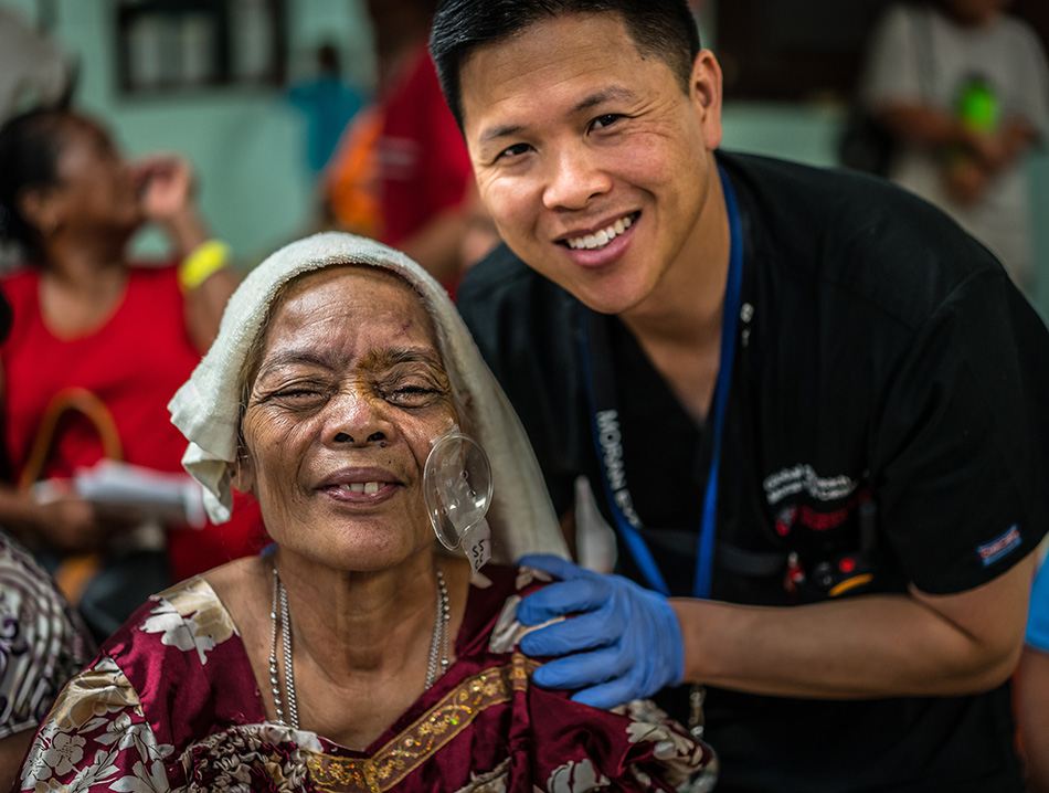 A photo of Craig J. Chaya, MD, with a patient during a Moran outreach trip to the Federated States of Micronesia.
