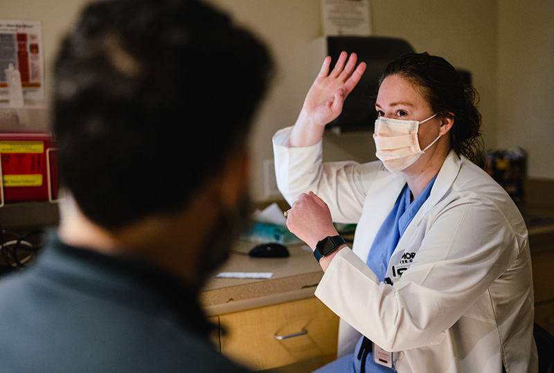 Theresa Long, MD, examines a patient during Moran’s Hope in Sight Redwood Outreach Clinic on Saturday, Aug. 21, 2021.