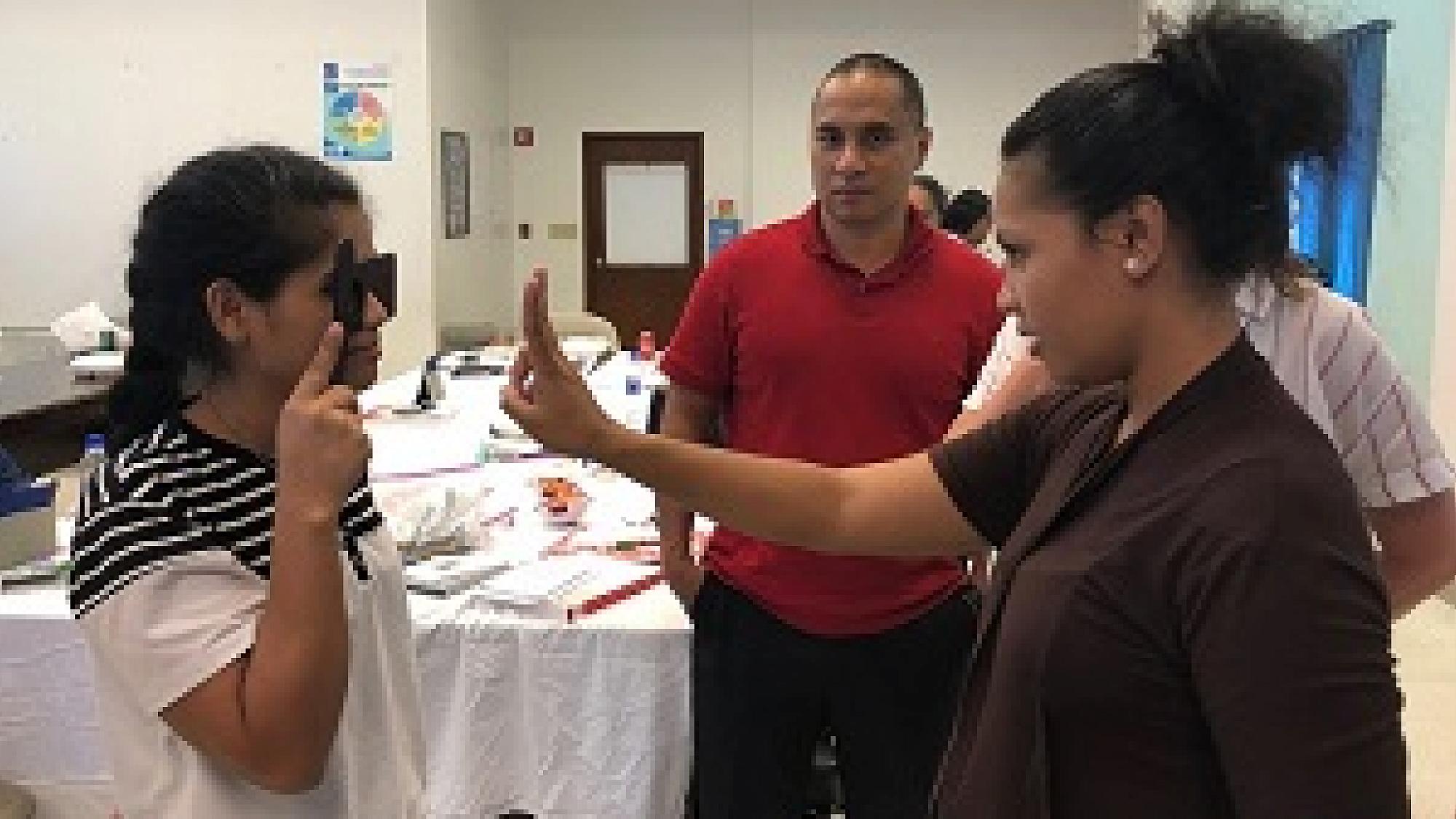 Micronesia’s only ophthalmologist Padwick Gallen, MD, center, assists with a nurse education program in December, conducted by the Moran Eye Center.
