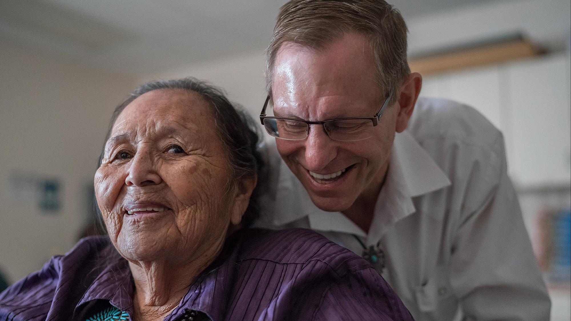 Dr. Crandall with a patient during an outreach trip to the Utah strip of the Navajo Nation.