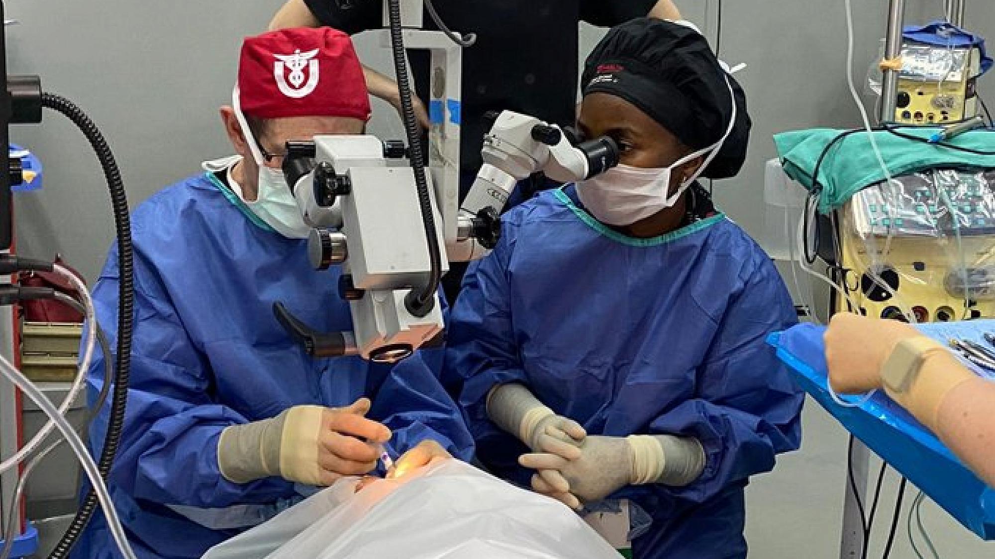 Dr. Crandall trains Evarista Mgaya, MD, during an outreach surgery clinic in Tanzania.