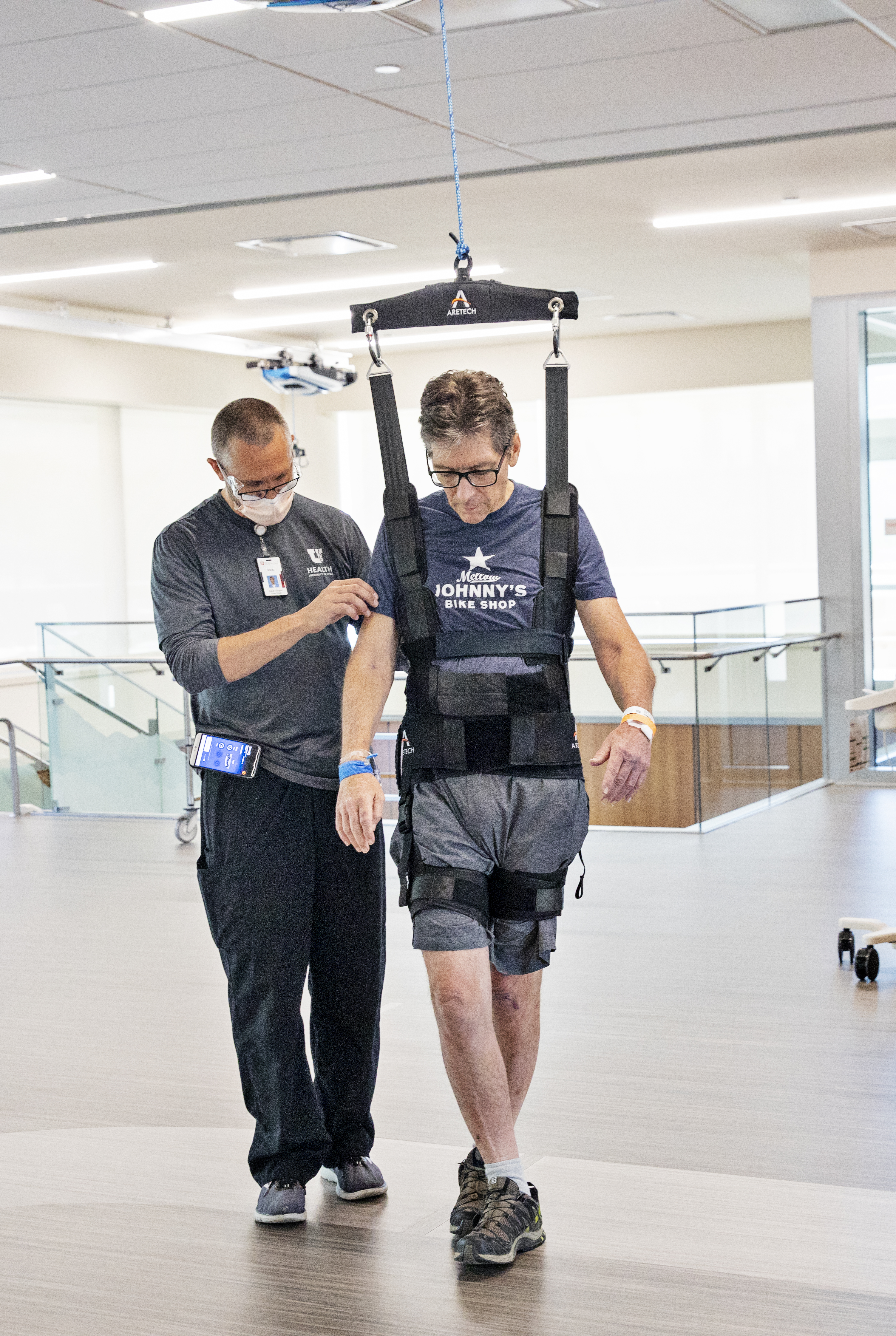 Picture of patient using ZeroG technology to help walk with physical therapist