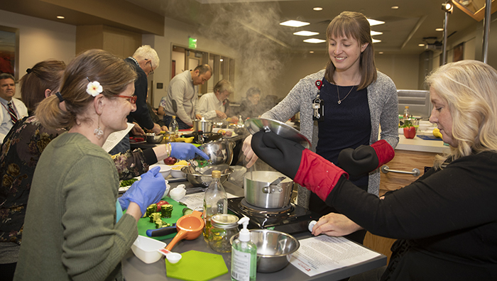 Cardio Cooking Class attendees cooking healthy meals