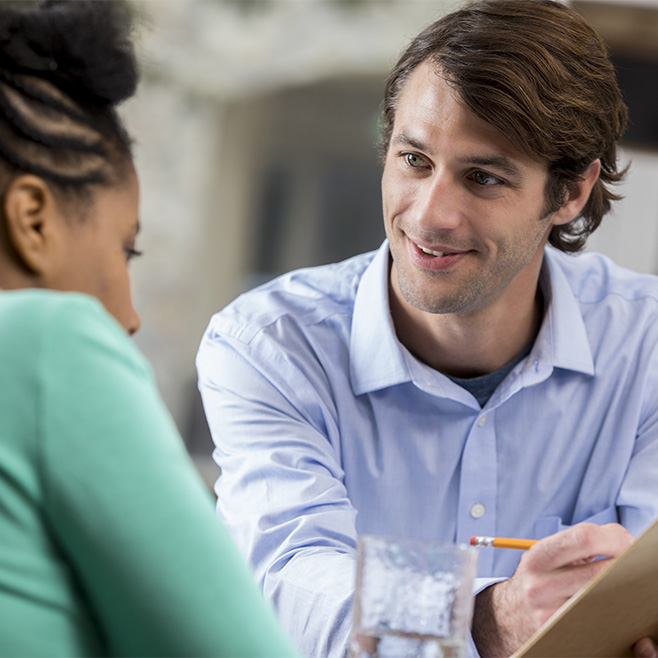 Neuropsychologist meets with patient