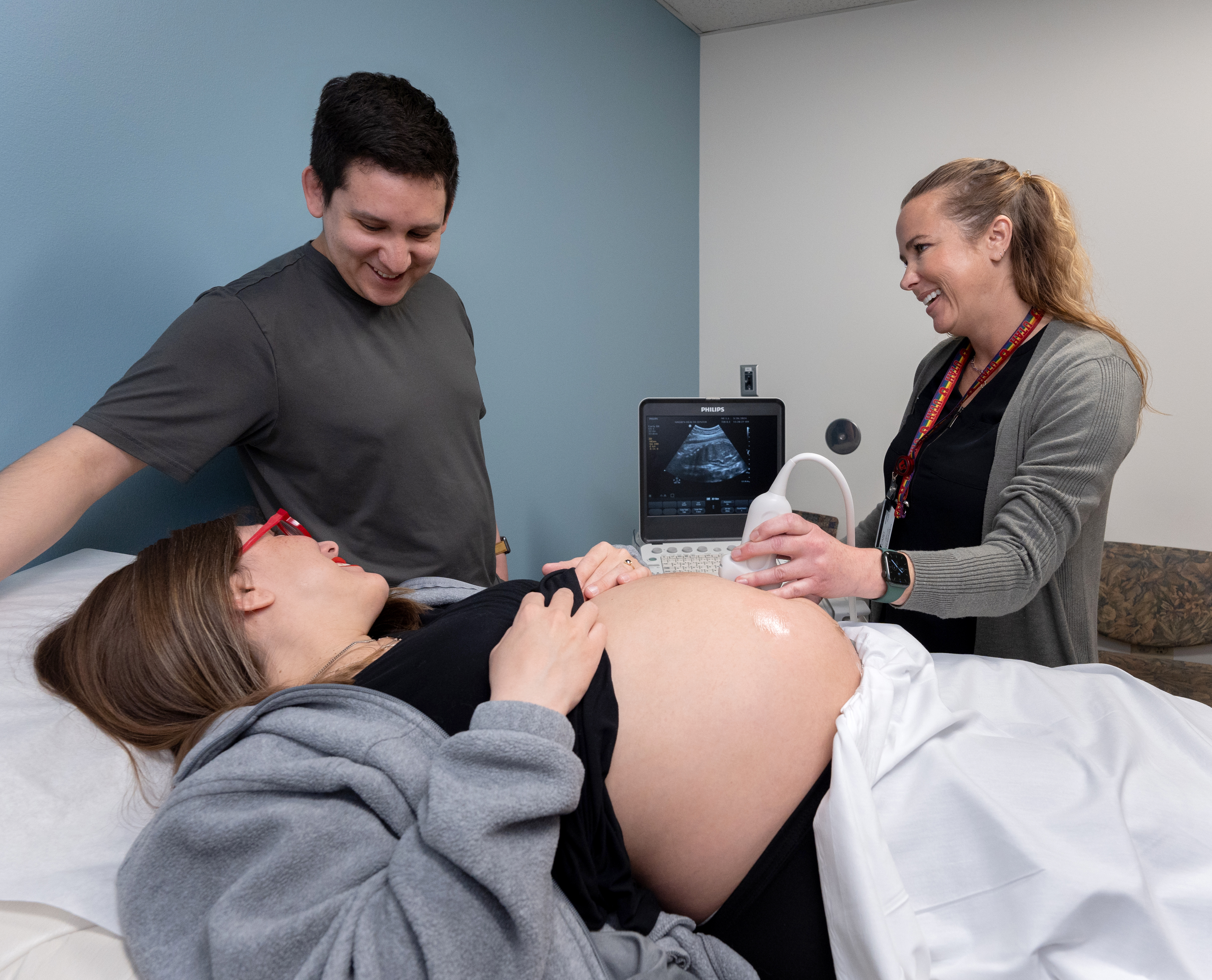 U of U Health midwife does an ultrasound with a young mother and father. 