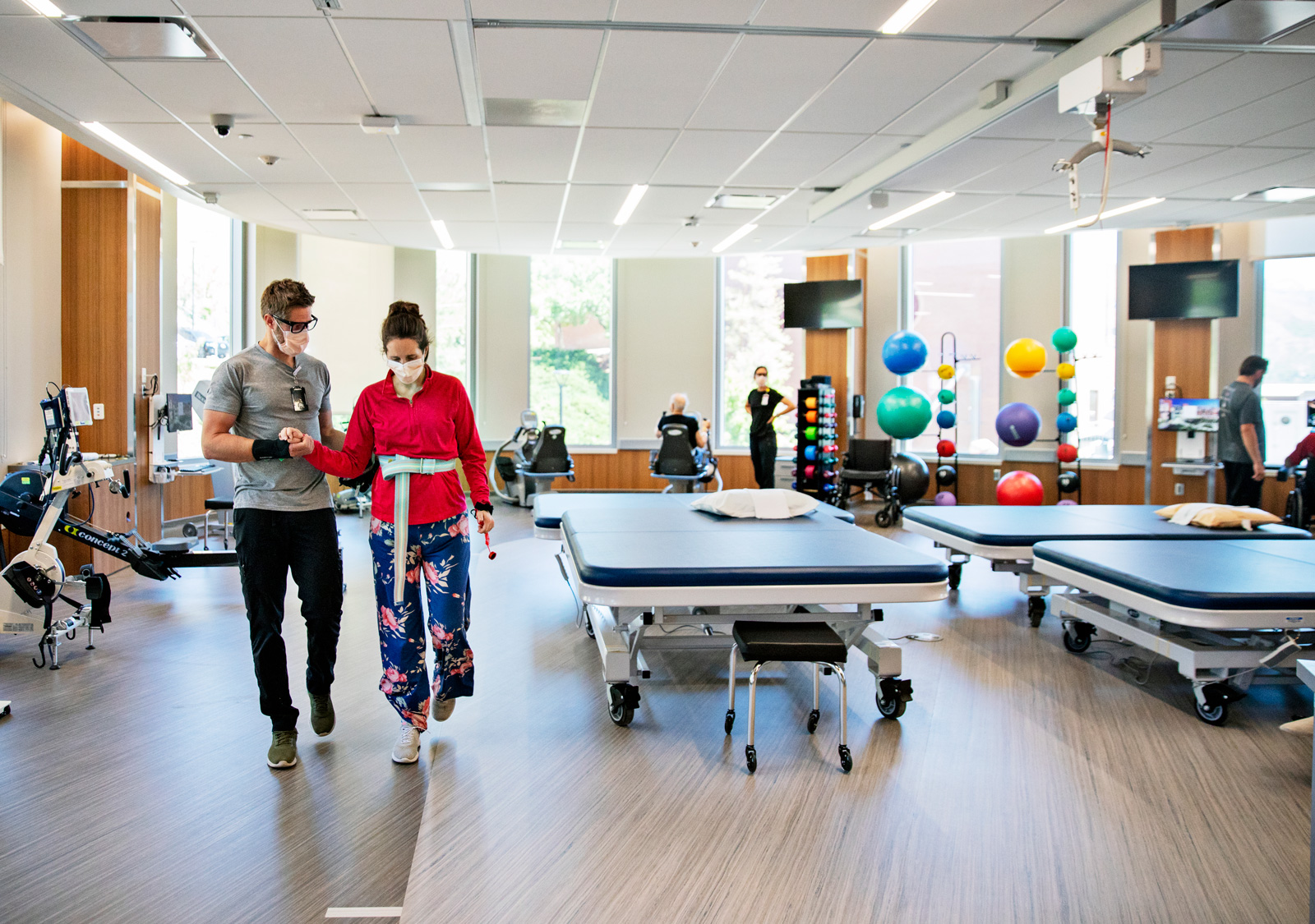 Stroke Patient walks with Physical Therapist