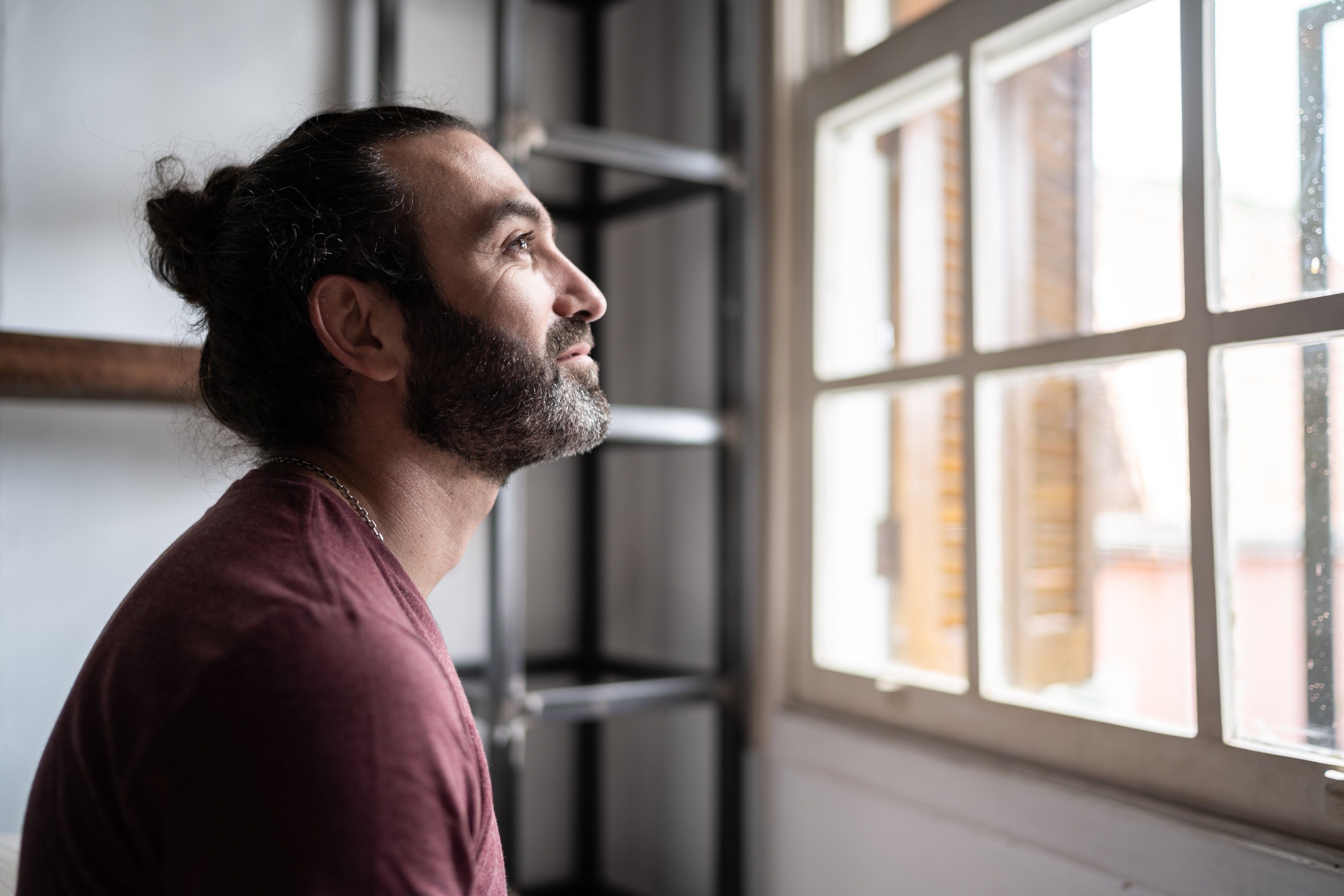 Picture of man staring out the window