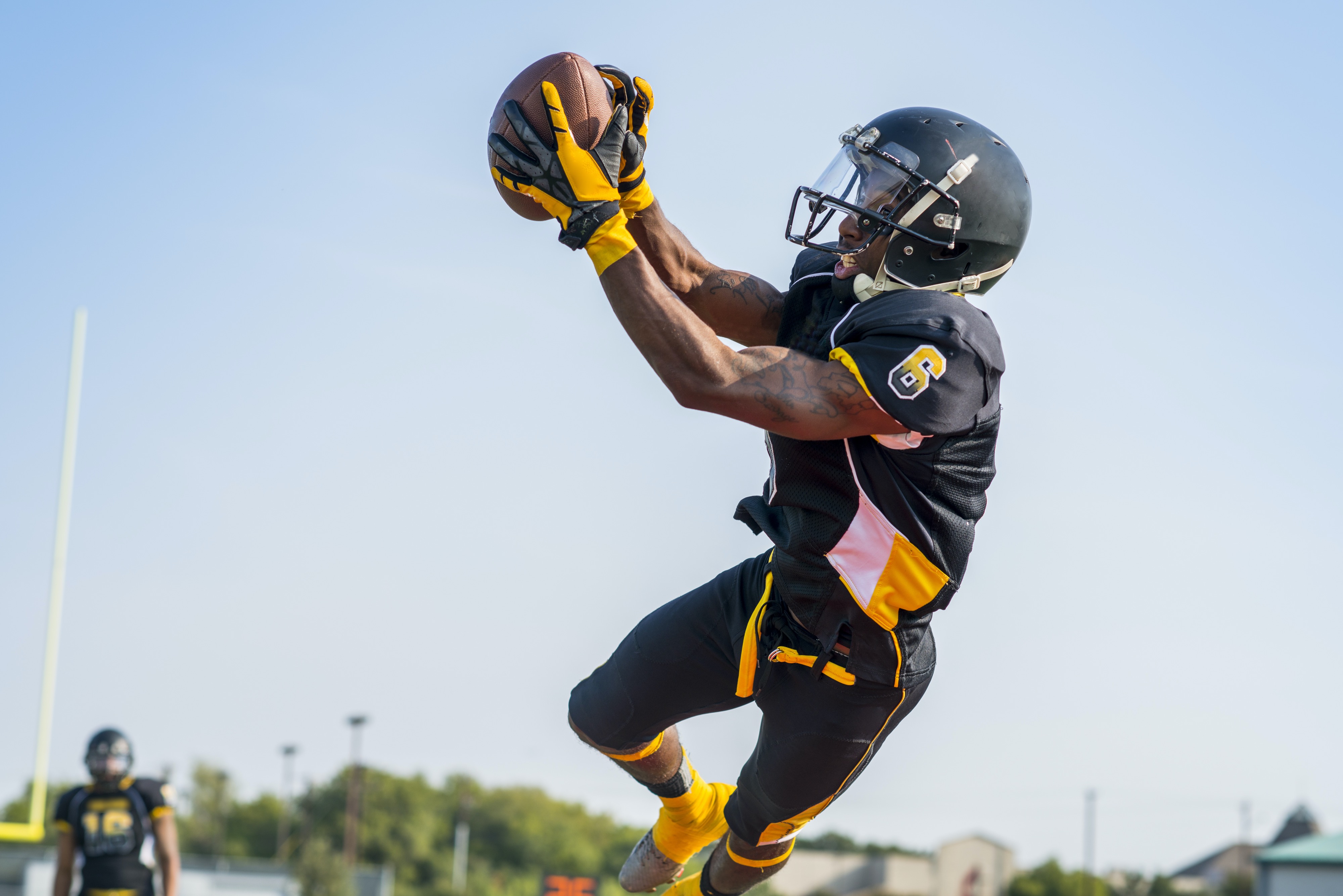 football player catching a ball