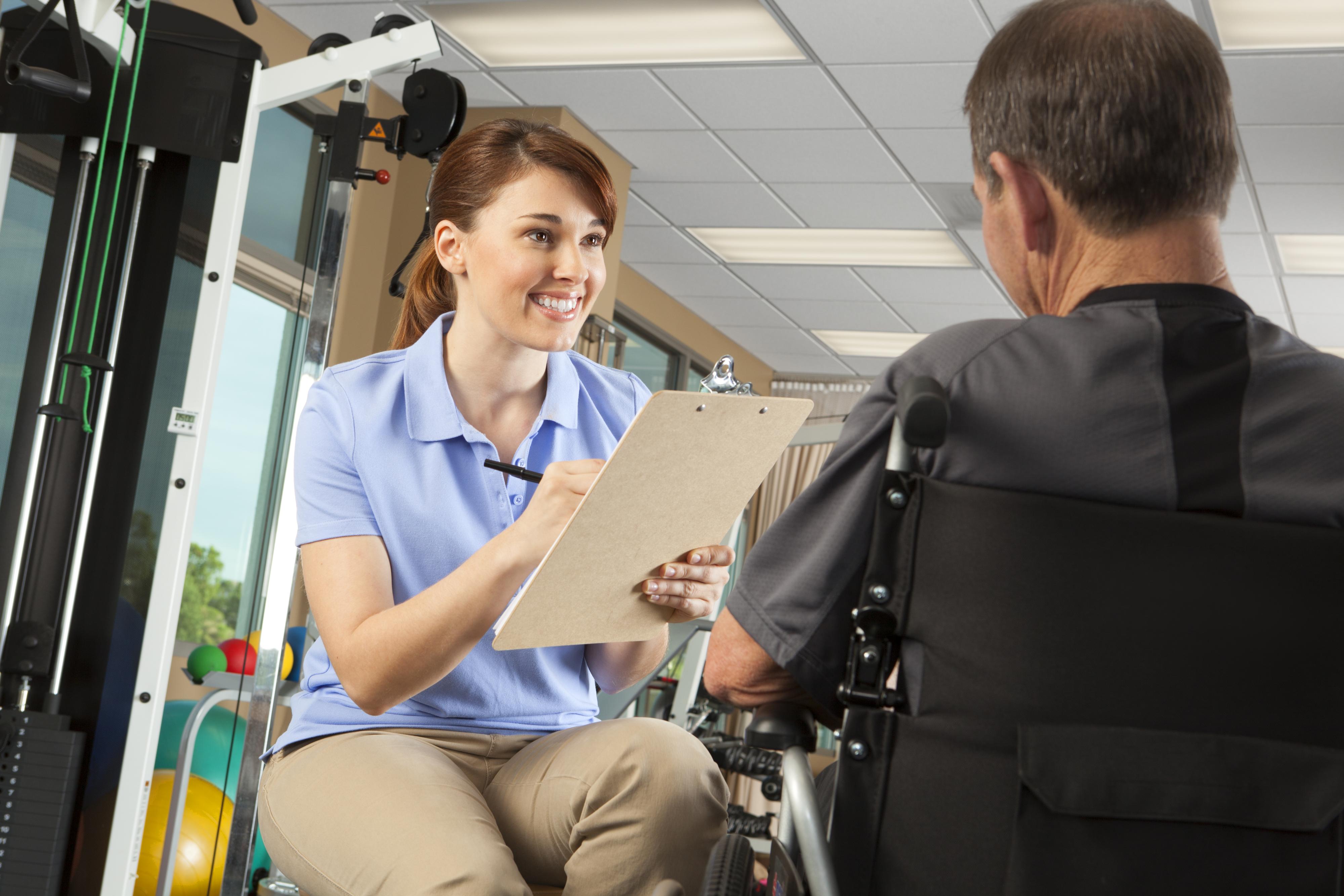 rehab patient discussing with trainer